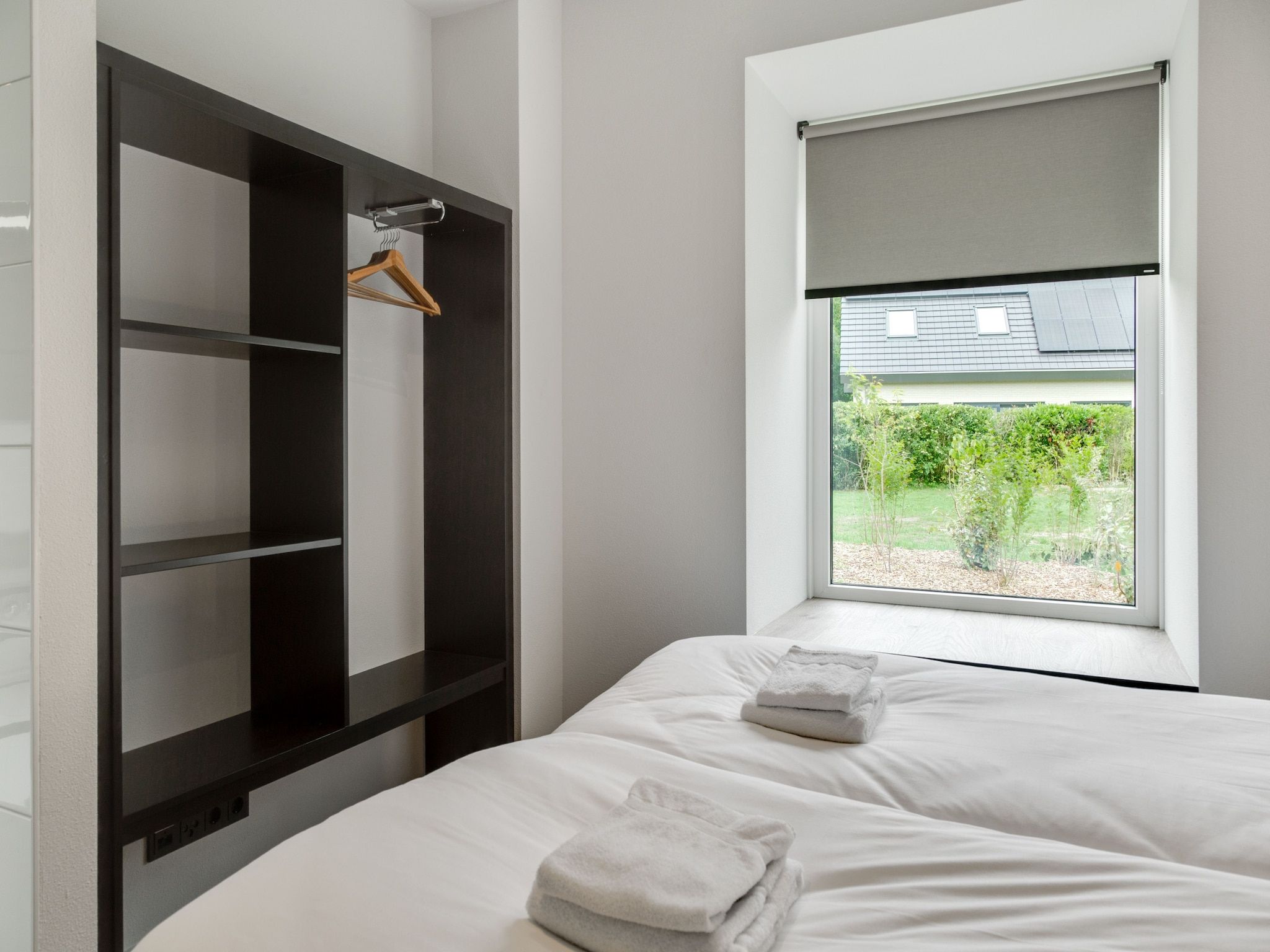 Een slaapkamer van De Koog nr 1 - 6 pers woning de luxe in De Koog Texel
