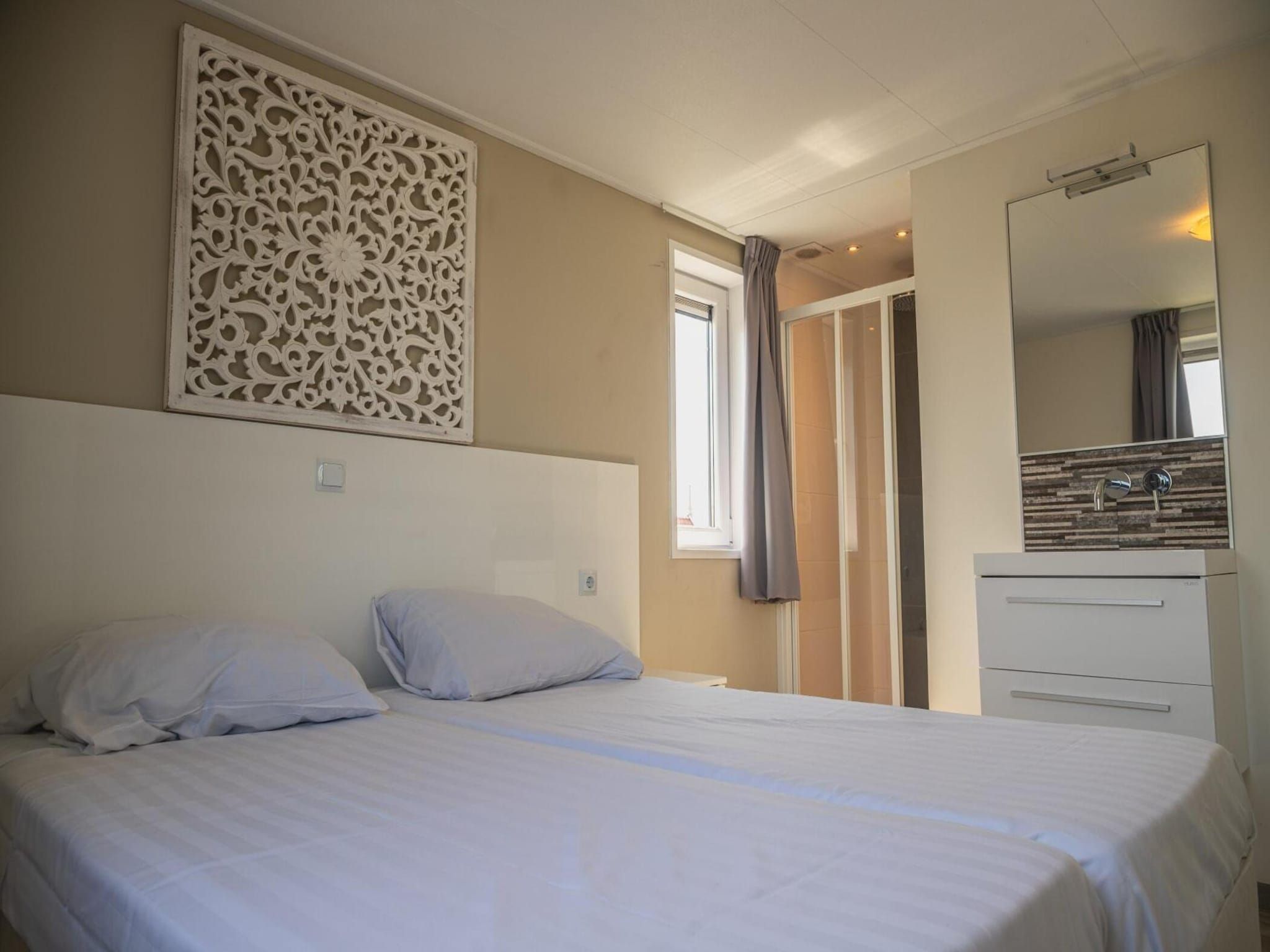 Een slaapkamer van Beemsterdijk met Sauna  10 personen in West-Graftdijk