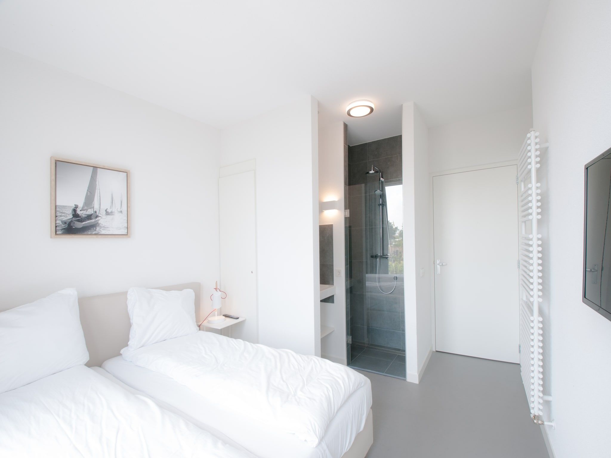 Een slaapkamer van Resort Waterrijk Oesterdam 9 in Tholen