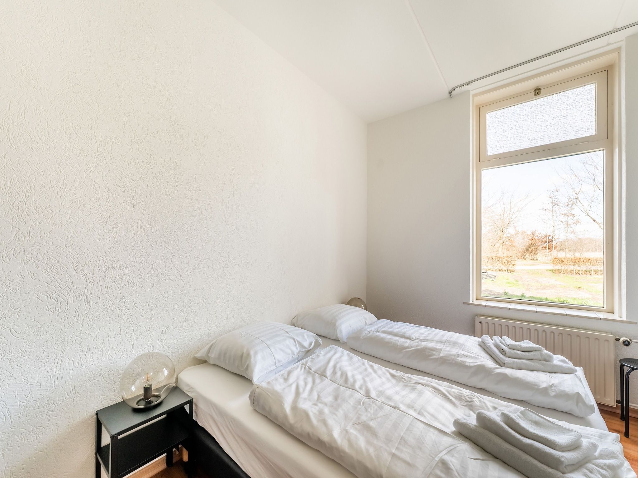 Een slaapkamer van Genieten in Silvolde in Silvolde