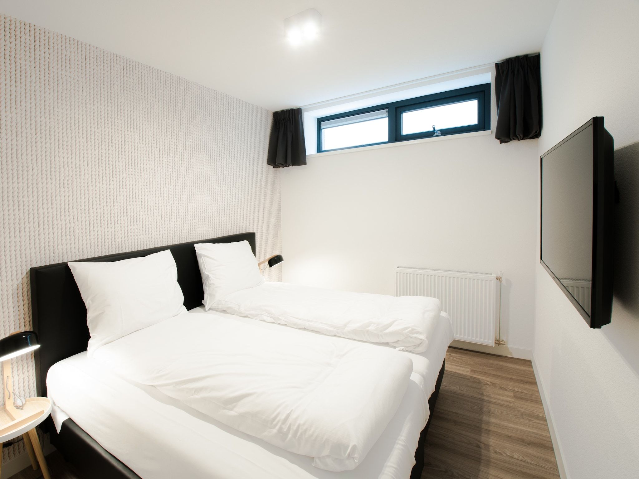 Een slaapkamer van Resort Waterrijk Oesterdam 16 in Tholen