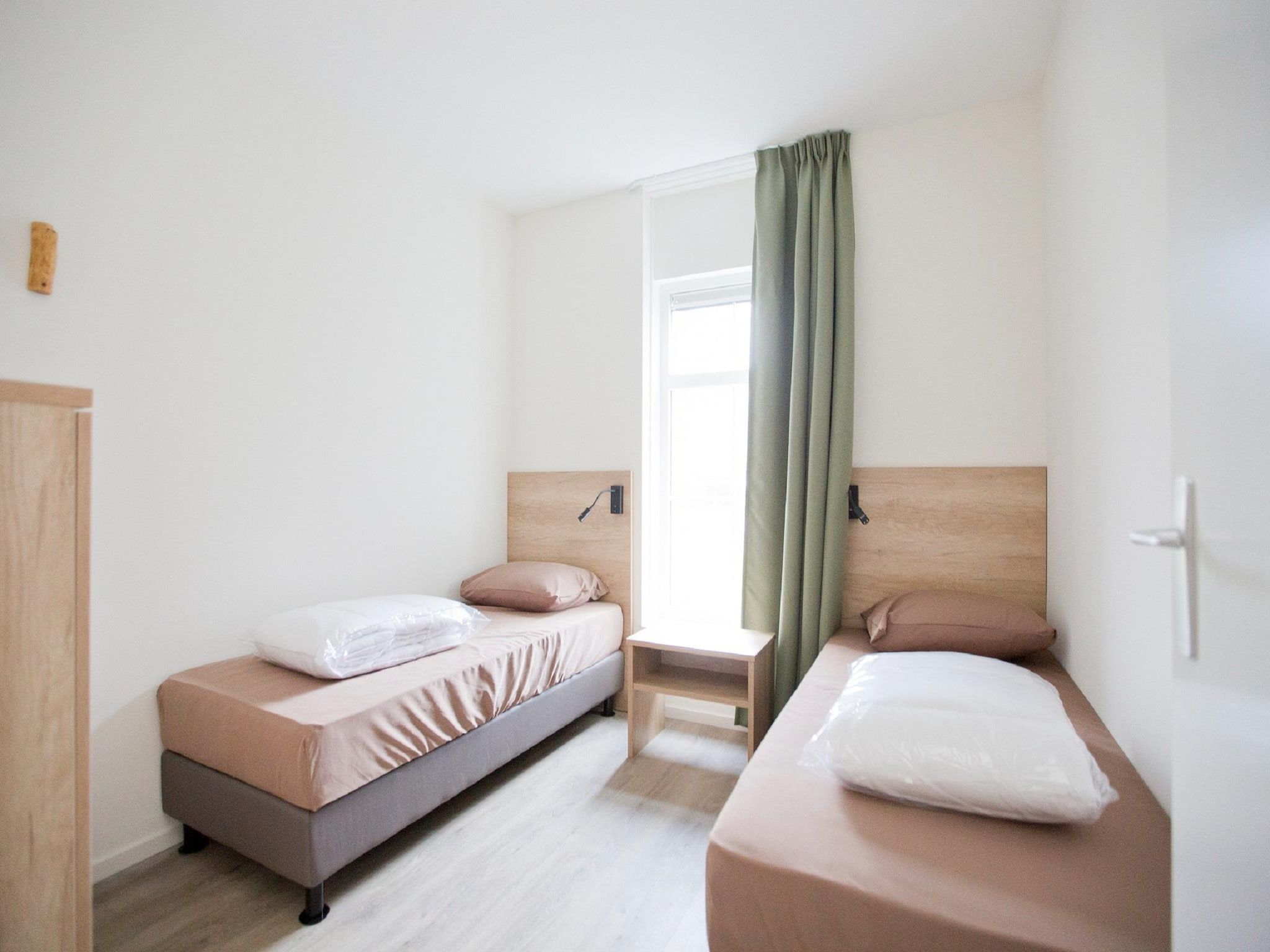 Een slaapkamer van Landgoed De IJsvogel 9 in Voorthuizen