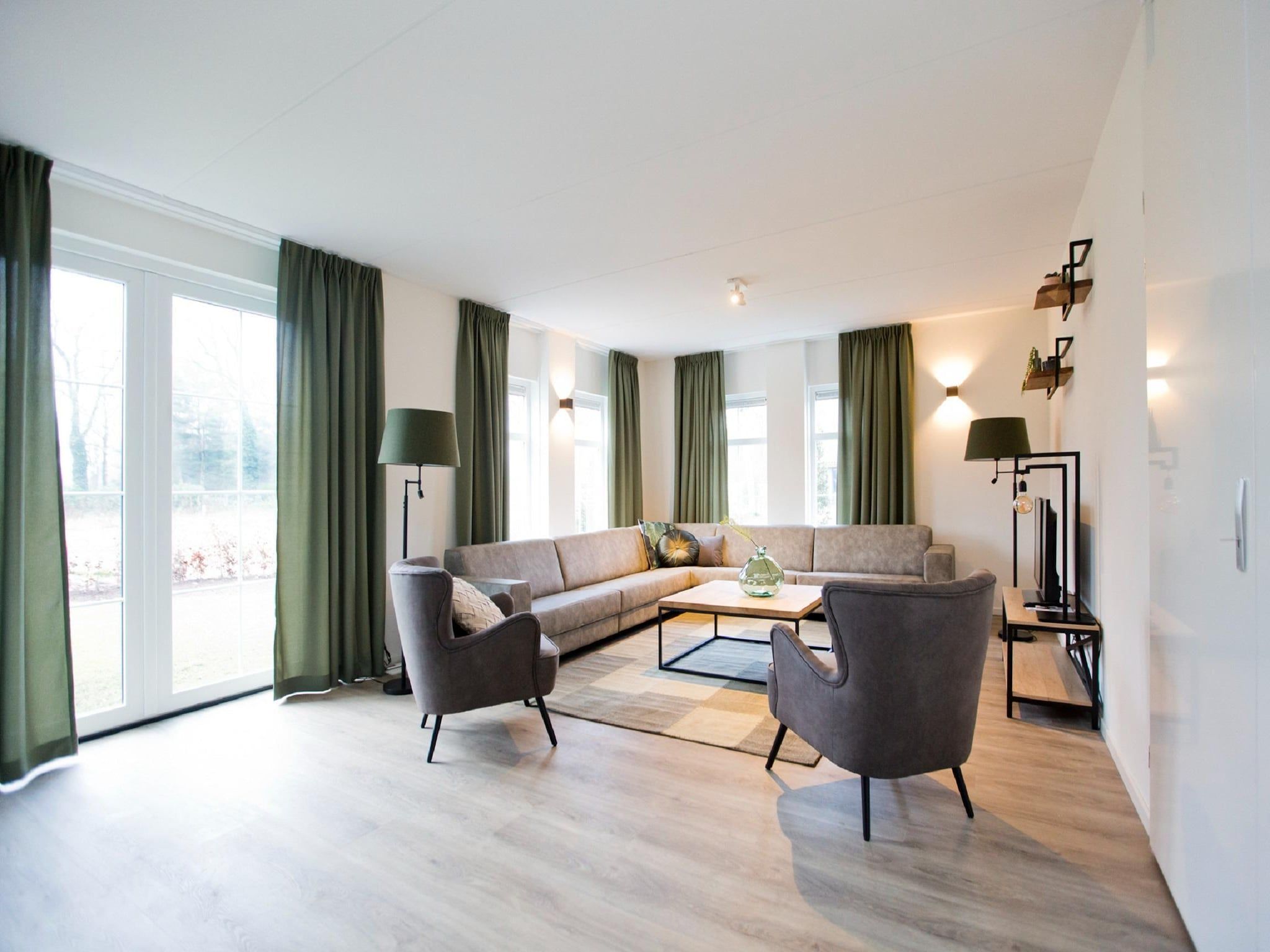 De woonkamer van Landgoed De IJsvogel 9 in Voorthuizen