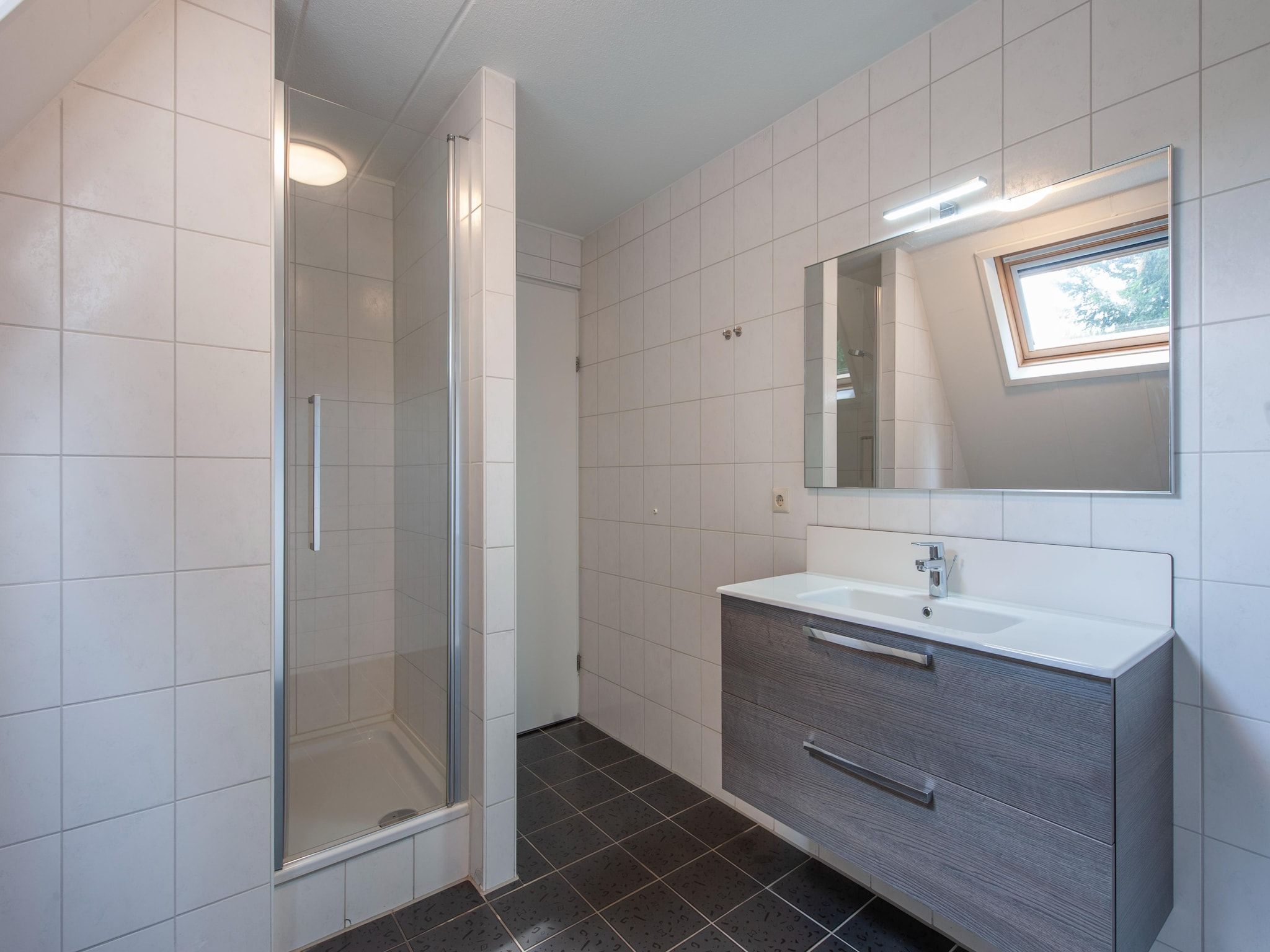 De badkamer van Vakantiepark de Katjeskelder 13 in Oosterhout