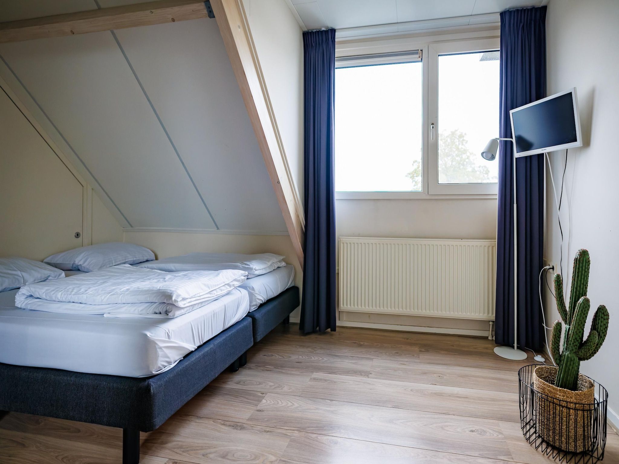 Een slaapkamer van Vakantiepark Eiland van Maurik 4 in Maurik