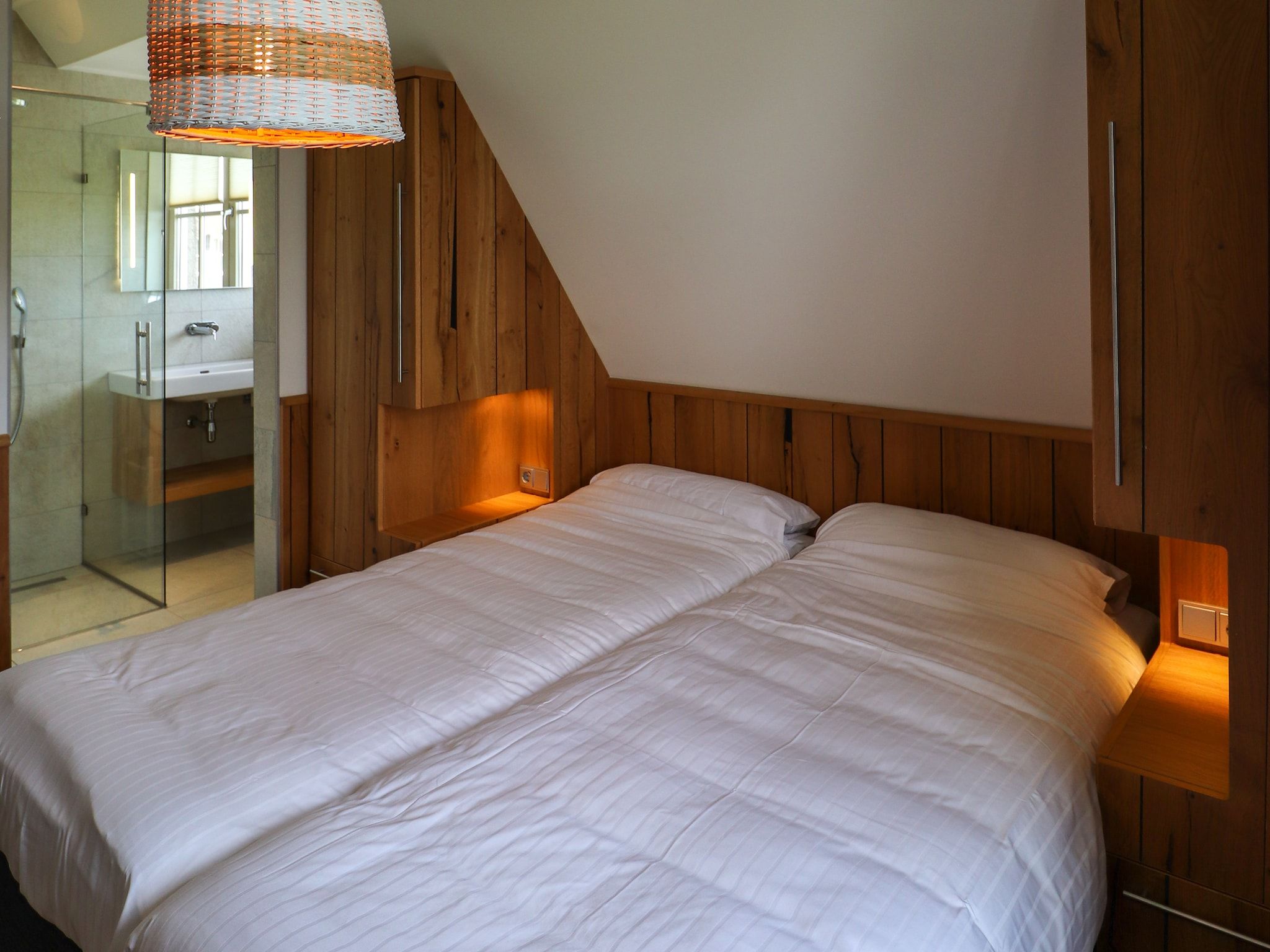 Een slaapkamer van Friese Meren Villa's 12 in Delfstrahuizen