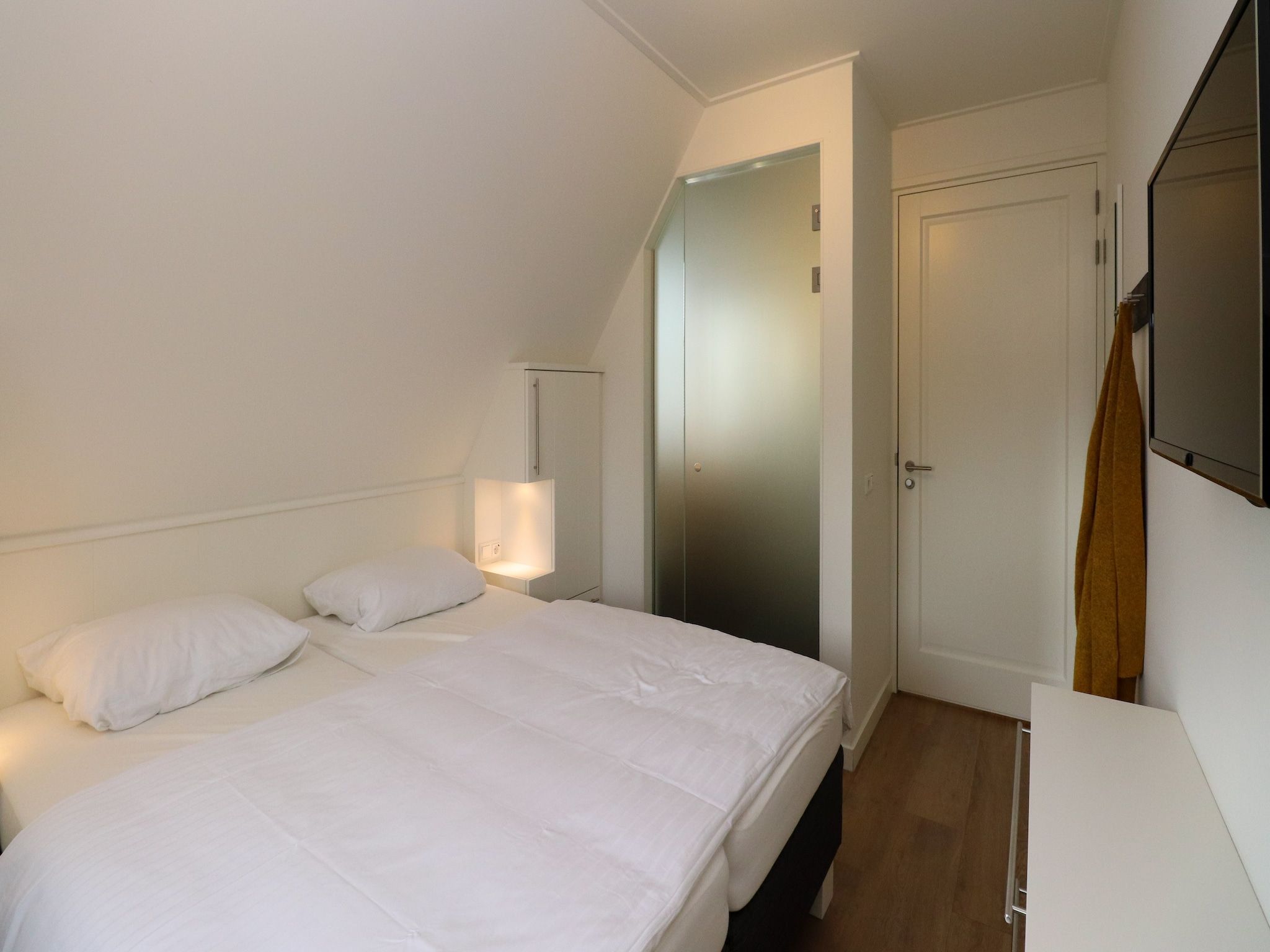 Een slaapkamer van Friese Meren Villa's 13 in Delfstrahuizen