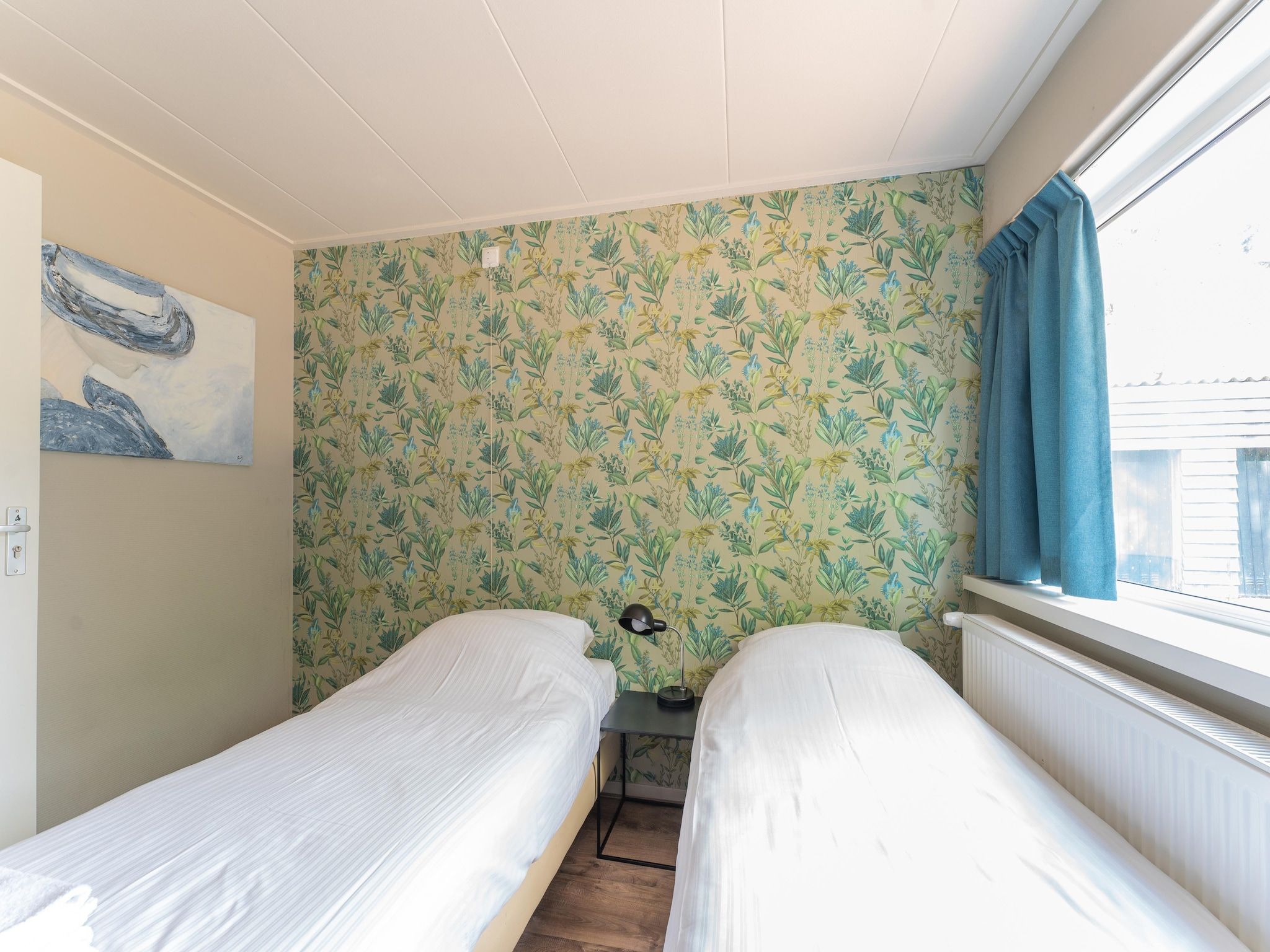 Een slaapkamer van Familiehuis Ruighenrode in Lochem