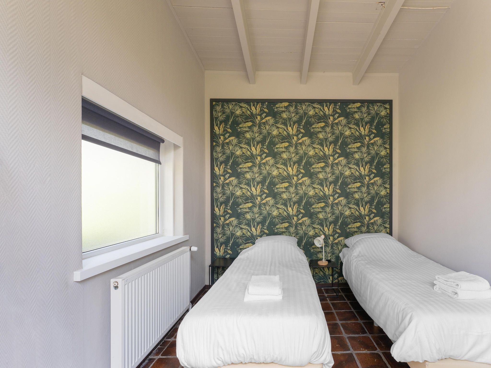 Een slaapkamer van Familiehuis Ruighenrode in Lochem