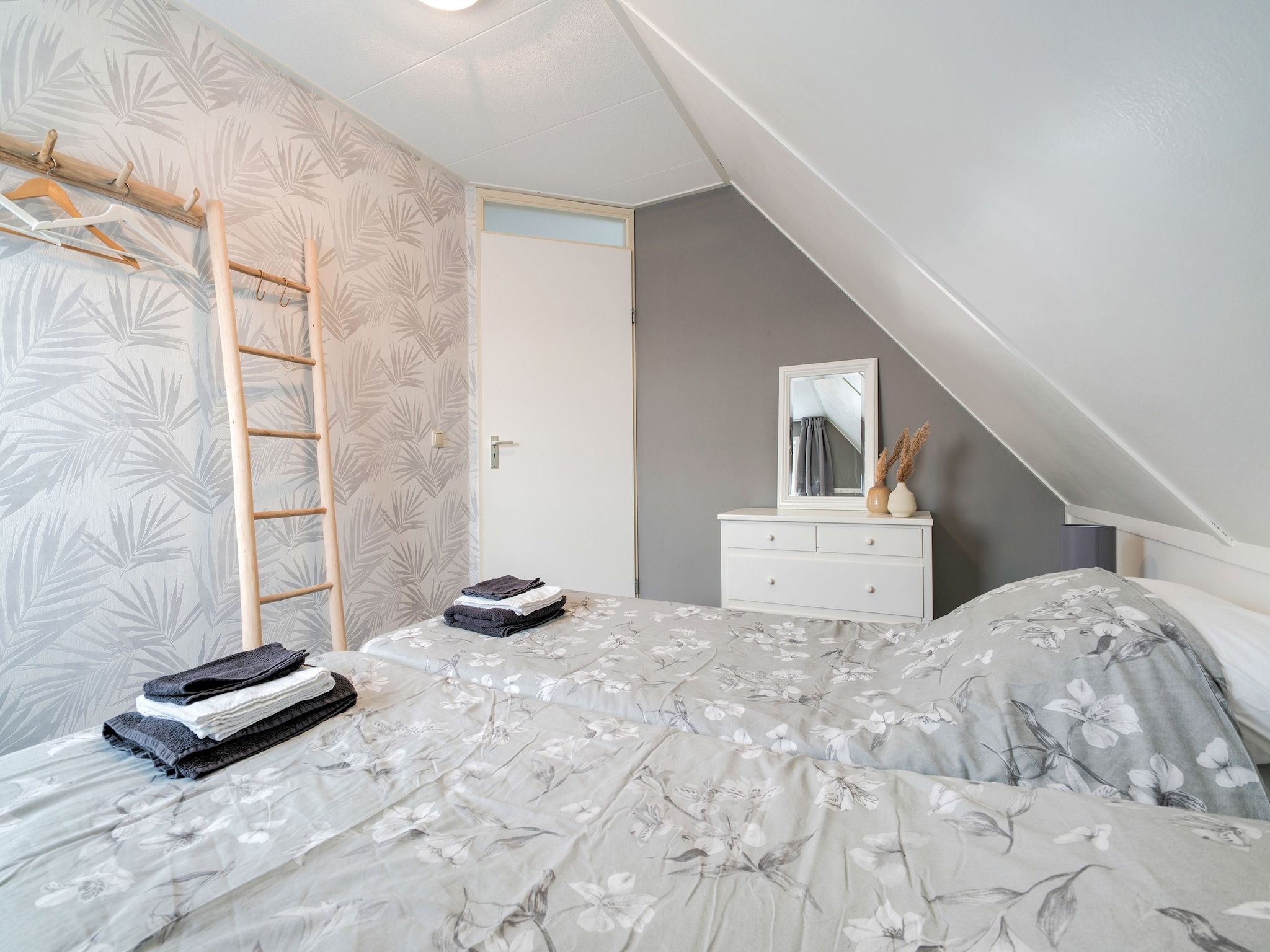 Een slaapkamer van Zonnig Hosterwold in Zeewolde