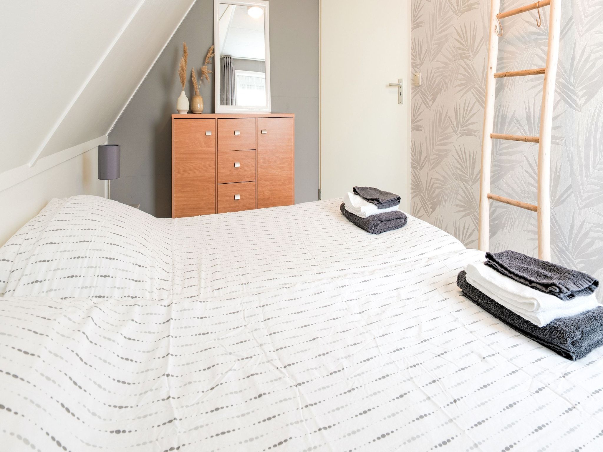 Een slaapkamer van Zonnig Hosterwold in Zeewolde