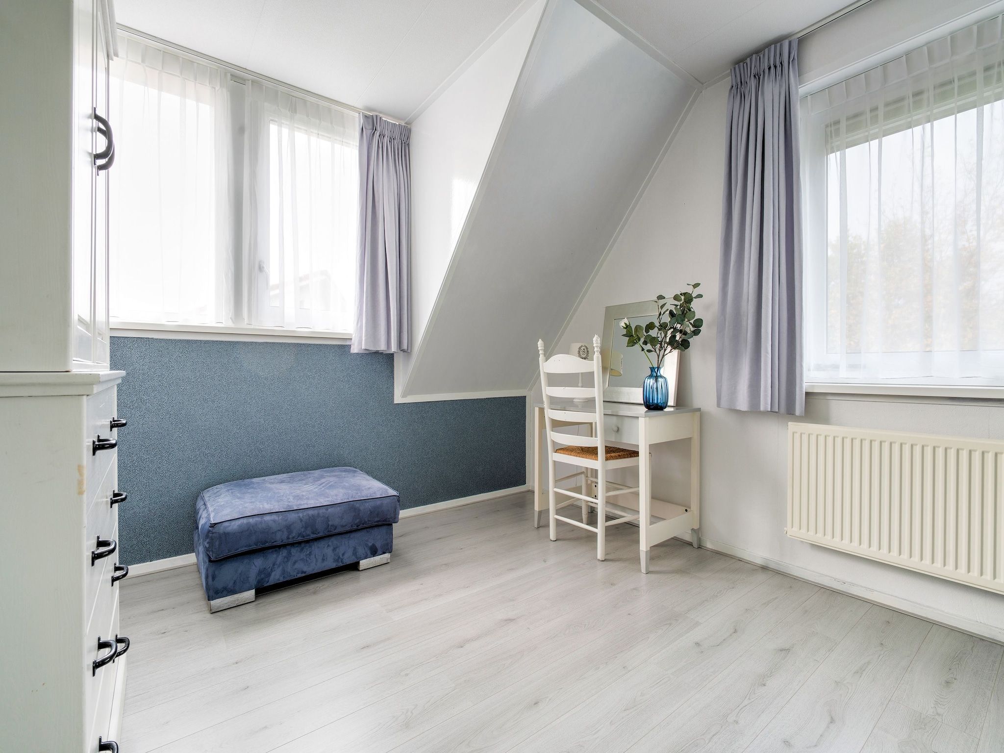 Een slaapkamer van Zonnig Hosterwold in Zeewolde