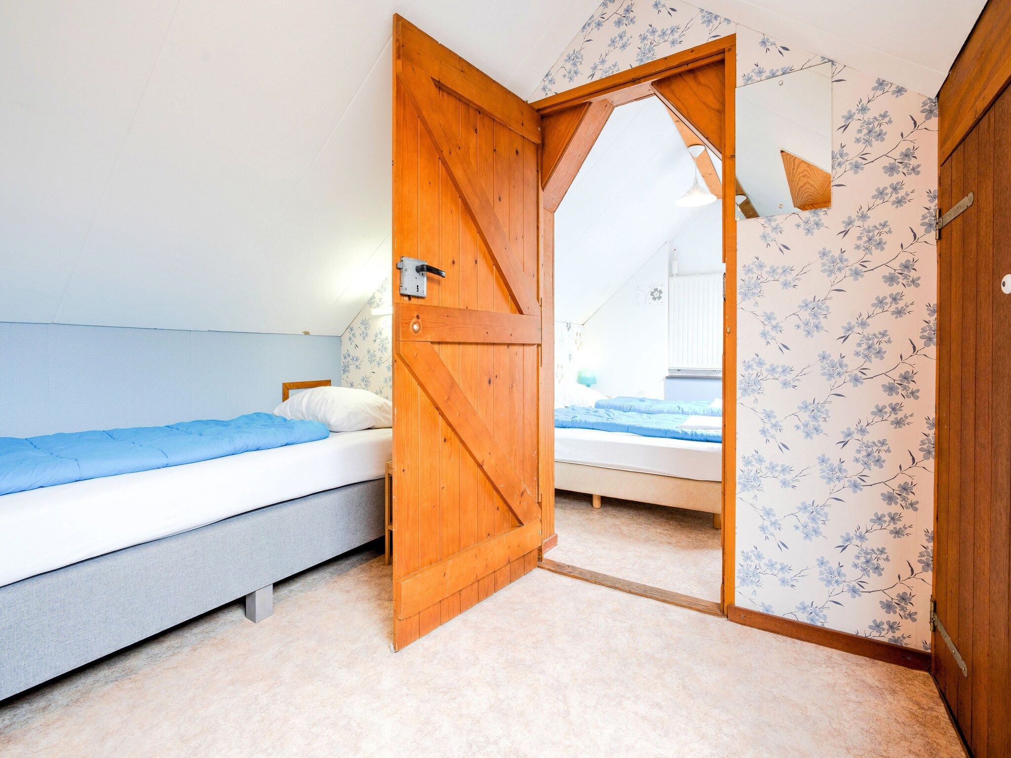 Een slaapkamer van De Wingerd 10P in Ulestraten