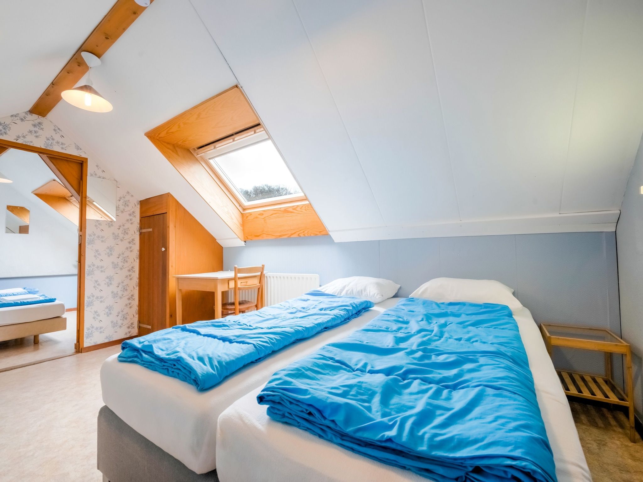 Een slaapkamer van De Wingerd 10P in Ulestraten