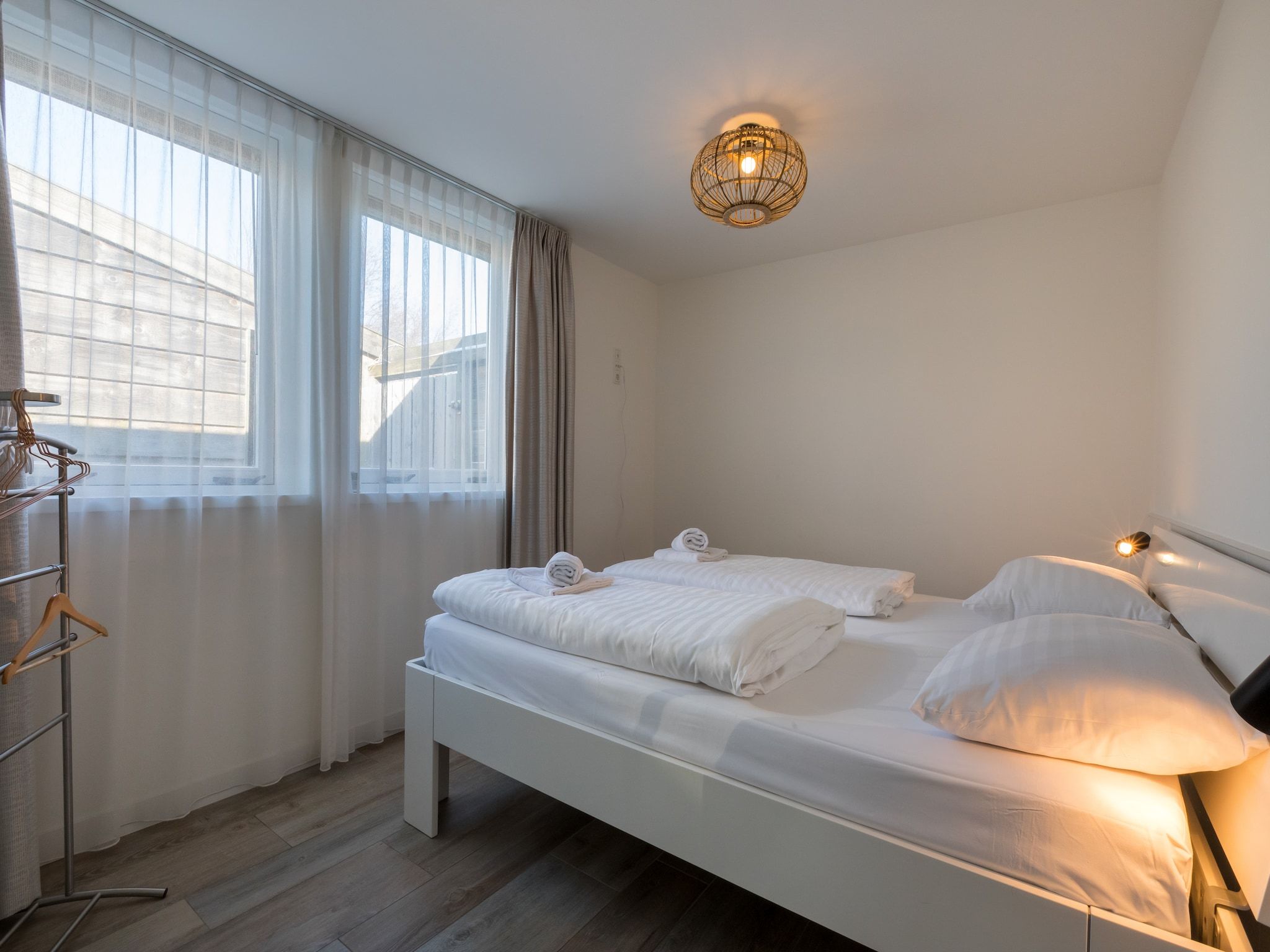 Een slaapkamer van Oostkapelseweg 32 -Ooievaar in Serooskerke