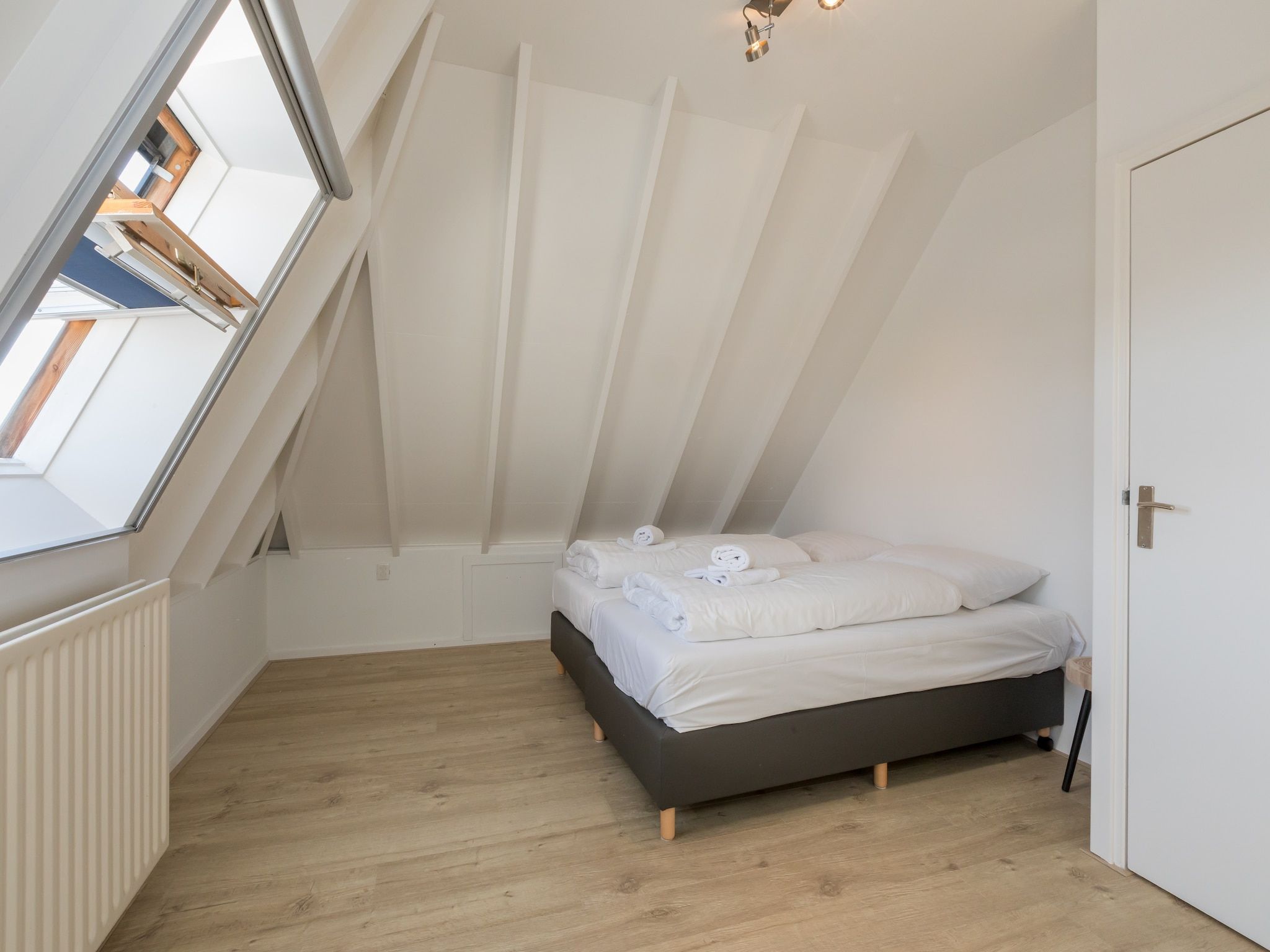 Een slaapkamer van Oostkapelseweg 32 -Ooievaar in Serooskerke