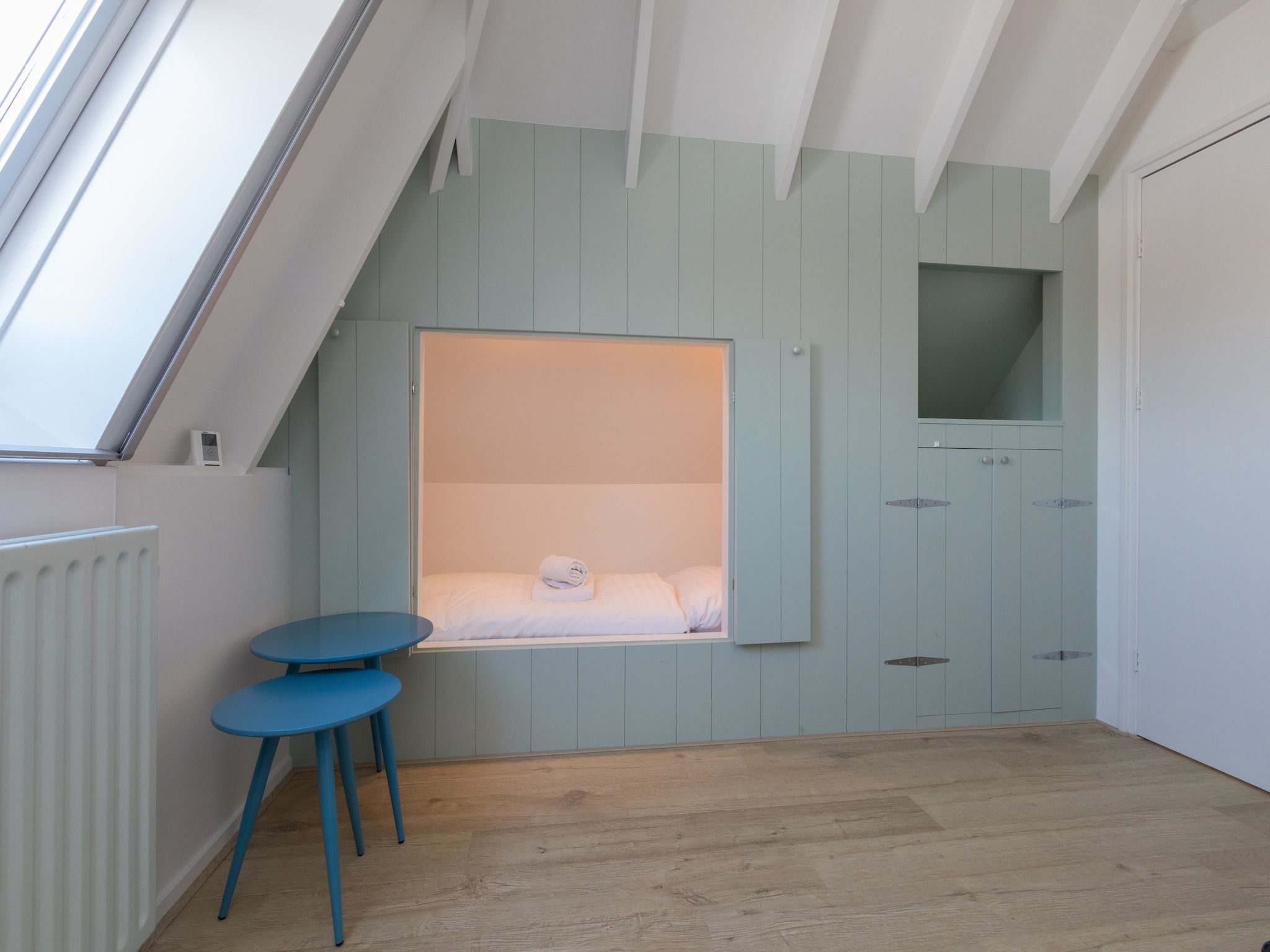 Een slaapkamer van Oostkapelseweg 32 -Ooievaar in Serooskerke