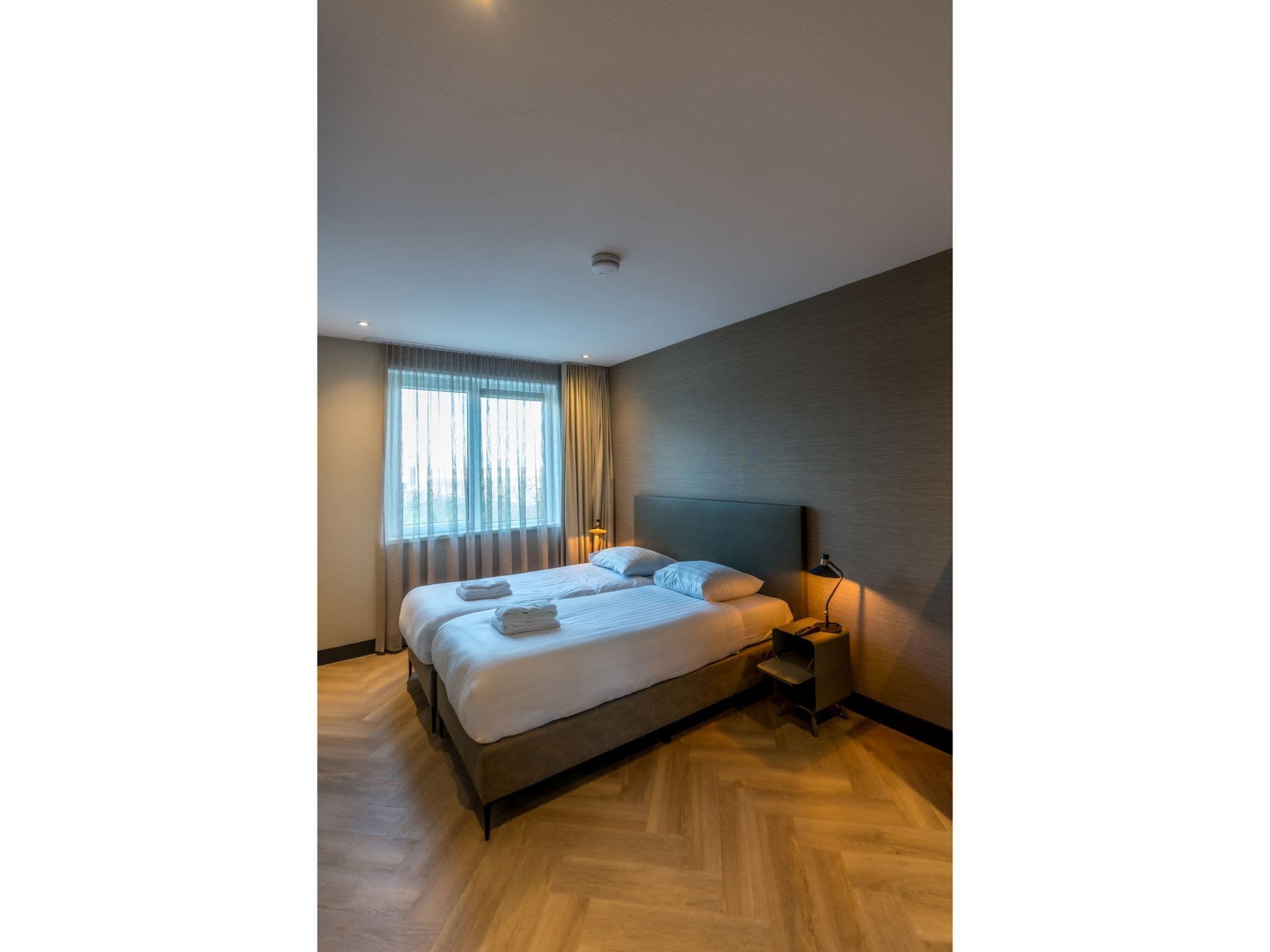 Een slaapkamer van O-Princenhof A 8 persoons in De Cocksdorp