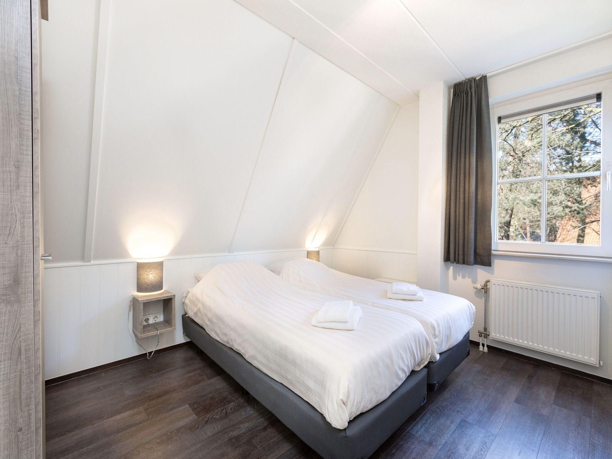 Een slaapkamer van Vakantiepark de Katjeskelder 17 in Oosterhout