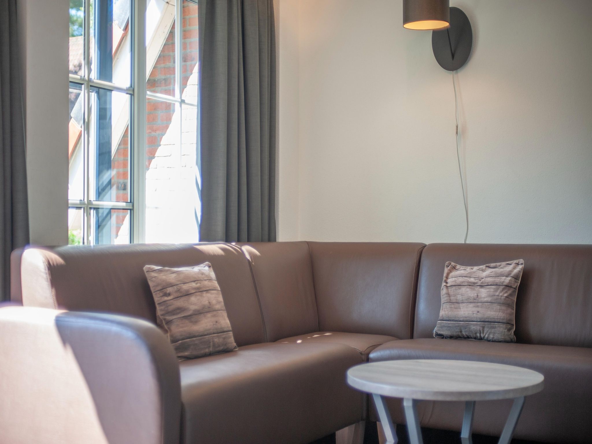 De woonkamer van Vakantiepark de Katjeskelder 18 in Oosterhout