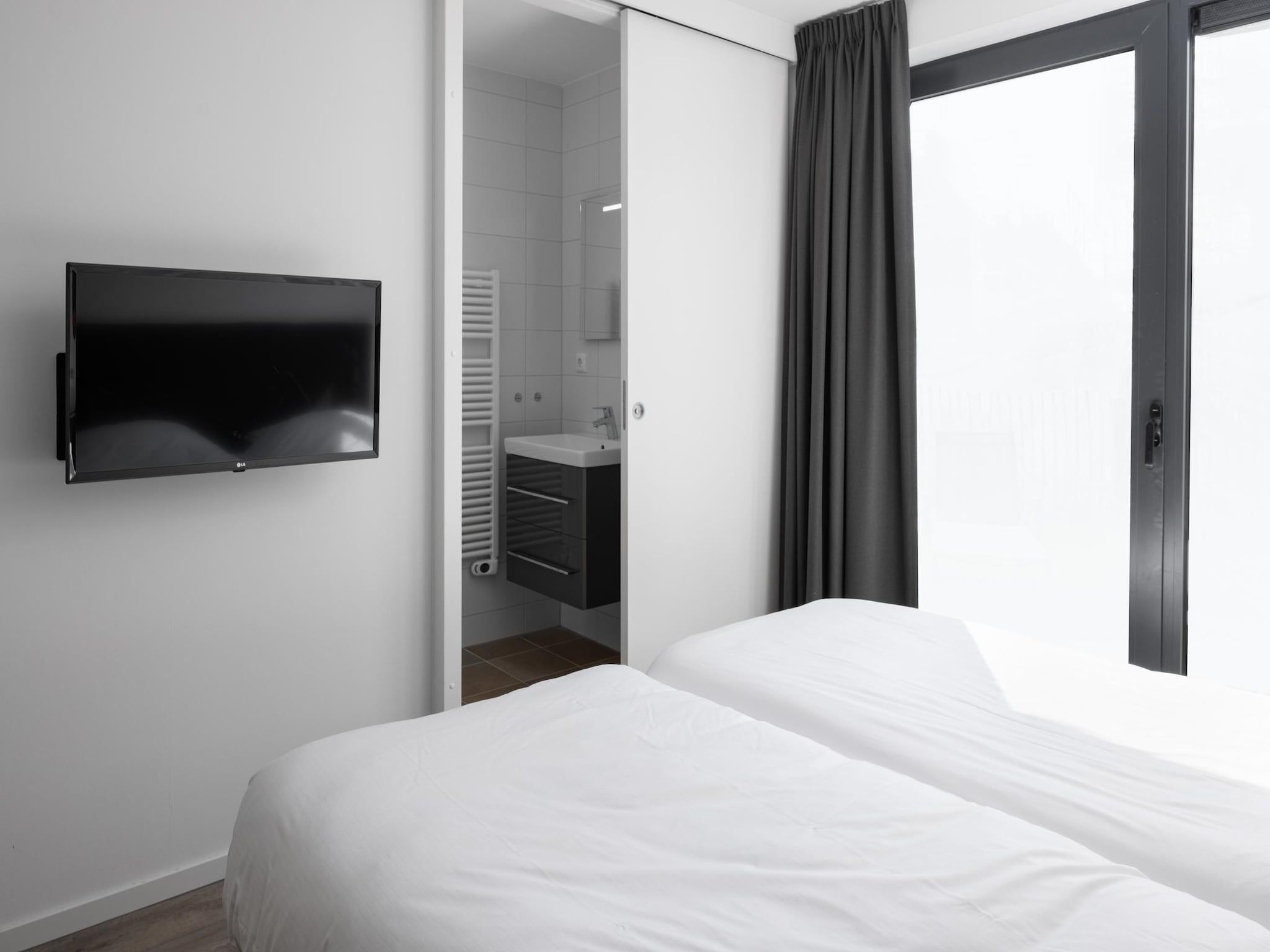 Een slaapkamer van Park Veerse Kreek 8 in Wolphaartsdijk