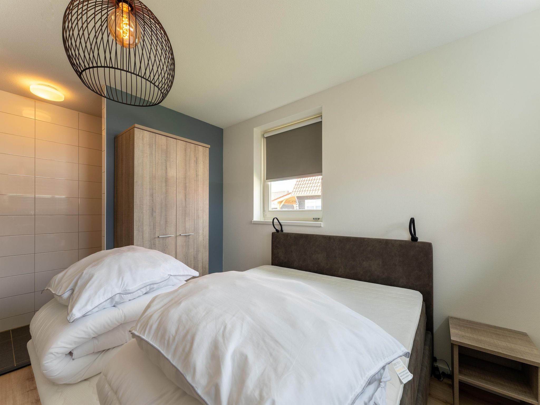 Een slaapkamer van De Scholekster Huis Nr 14 in Scherpenisse