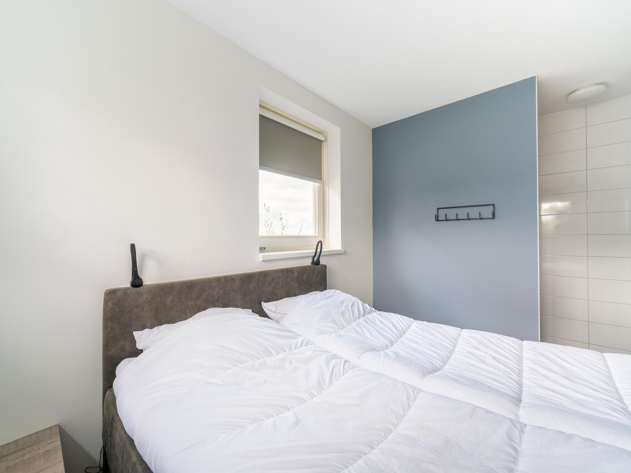 Een slaapkamer van De Kluut Huis Nr 12 in Scherpenisse