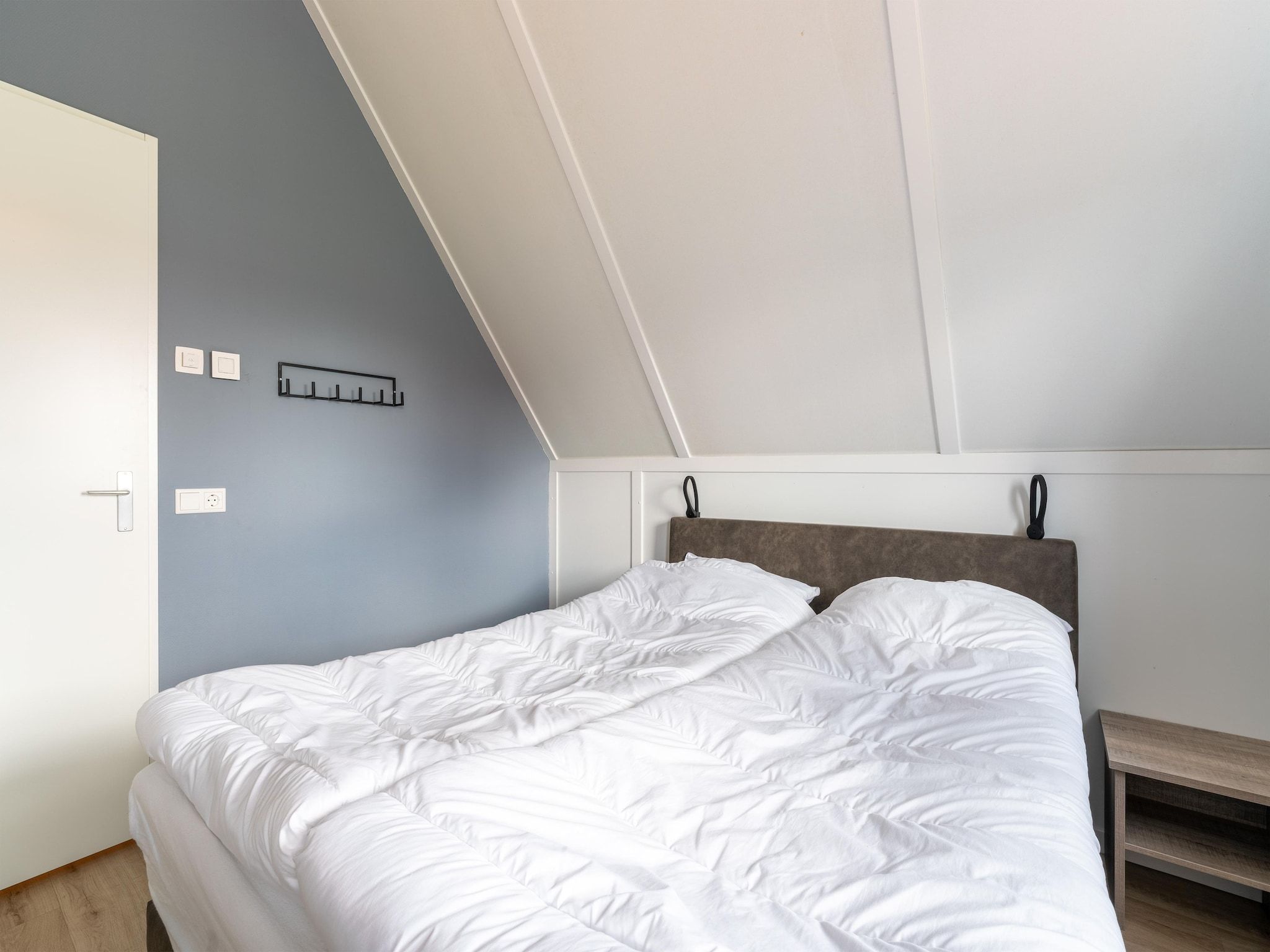 Een slaapkamer van De Kluut Huis Nr 12 in Scherpenisse