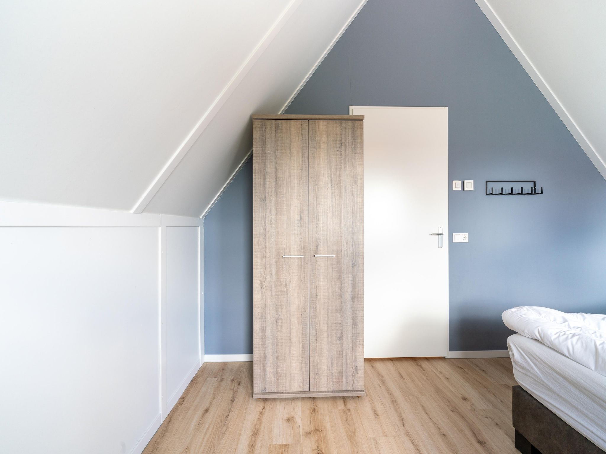 Een slaapkamer van De Kluut Huis Nr 12 in Scherpenisse