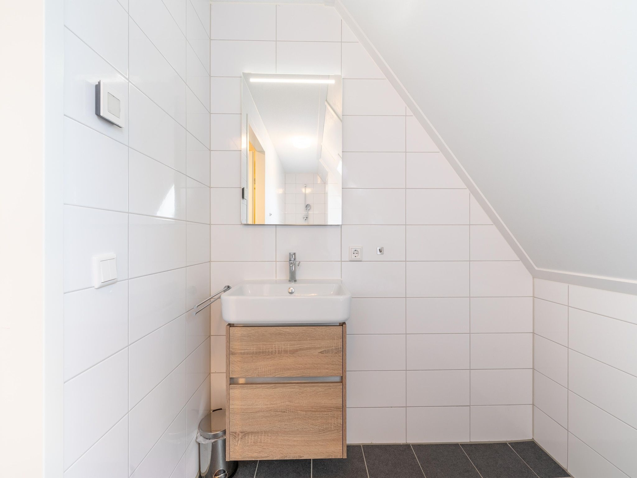 De badkamer van De Kluut Huis Nr 12 in Scherpenisse