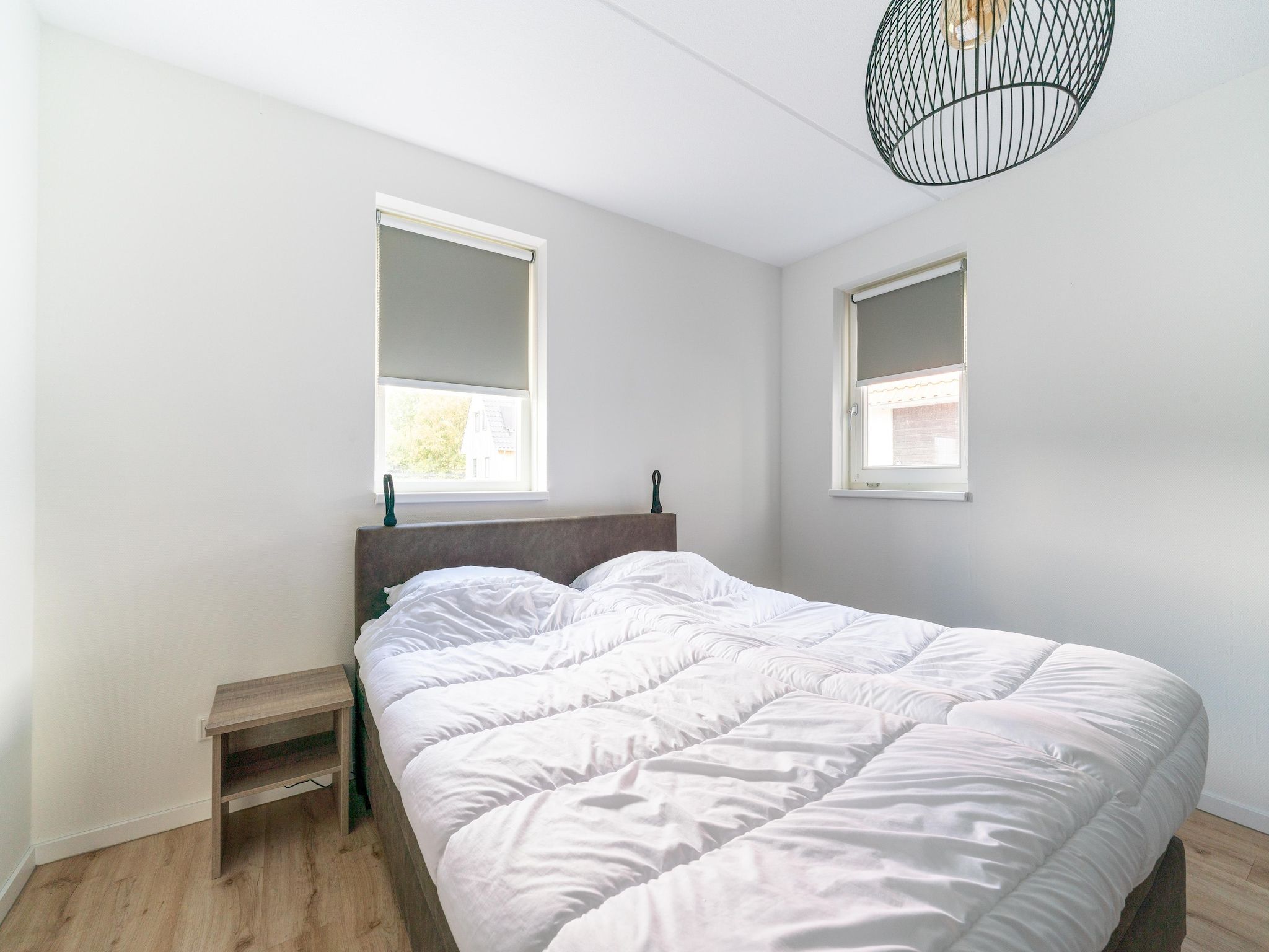 Een slaapkamer van De Kluut Huis Nr 12 in Scherpenisse