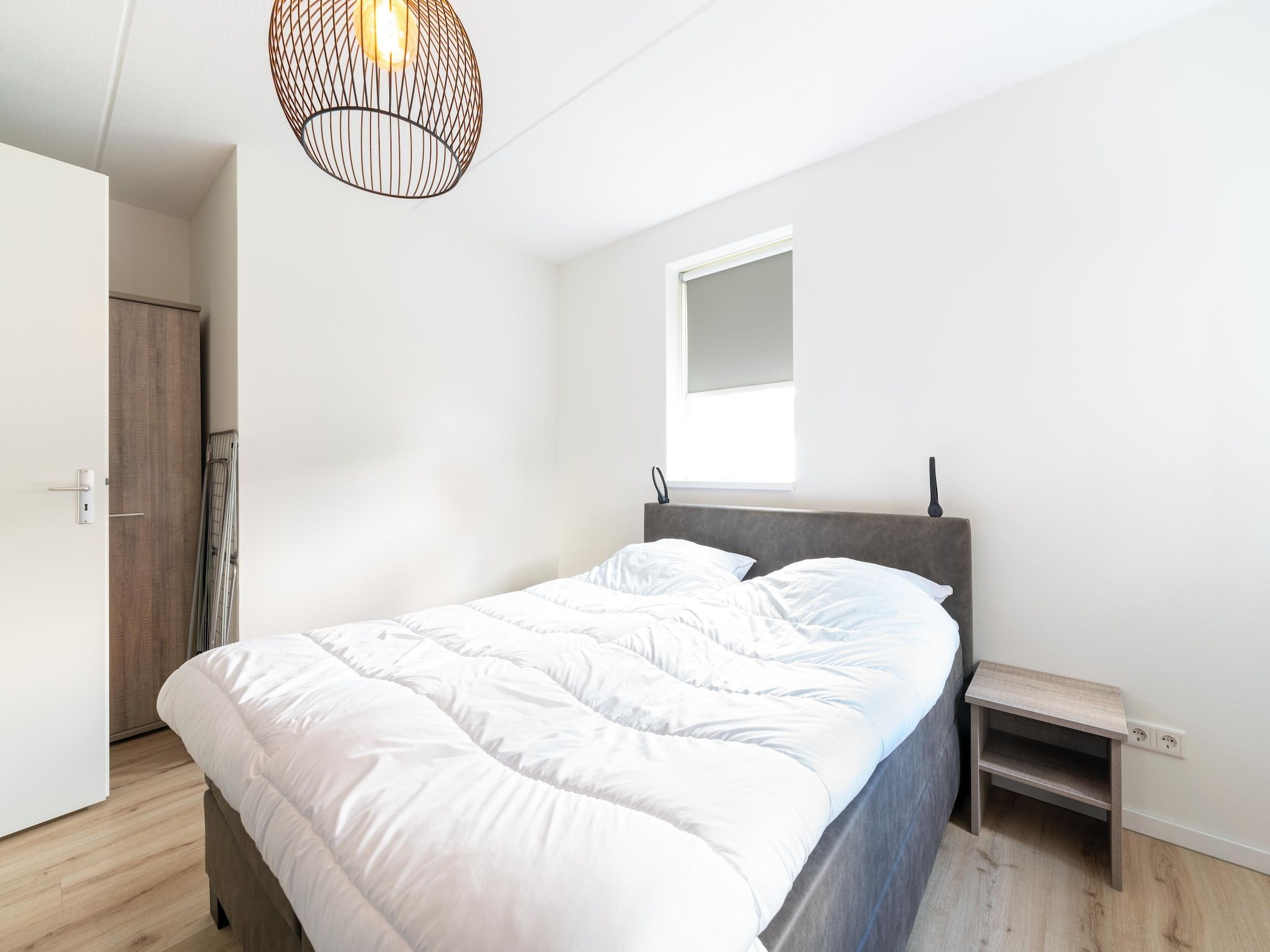 Een slaapkamer van De Kluut Huis Nr 12 in Scherpenisse