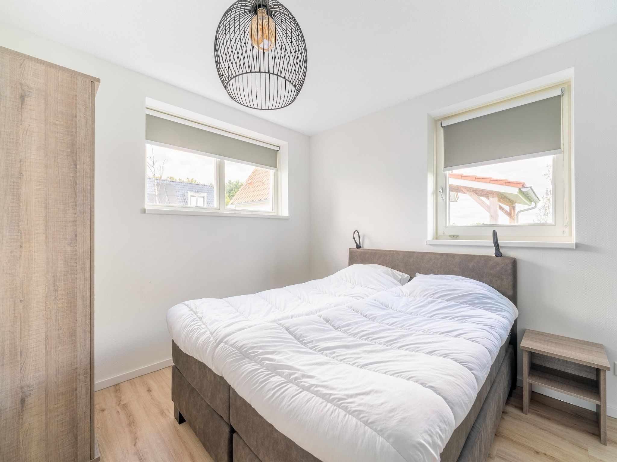 Een slaapkamer van De Kluut Huis Nr 12 in Scherpenisse