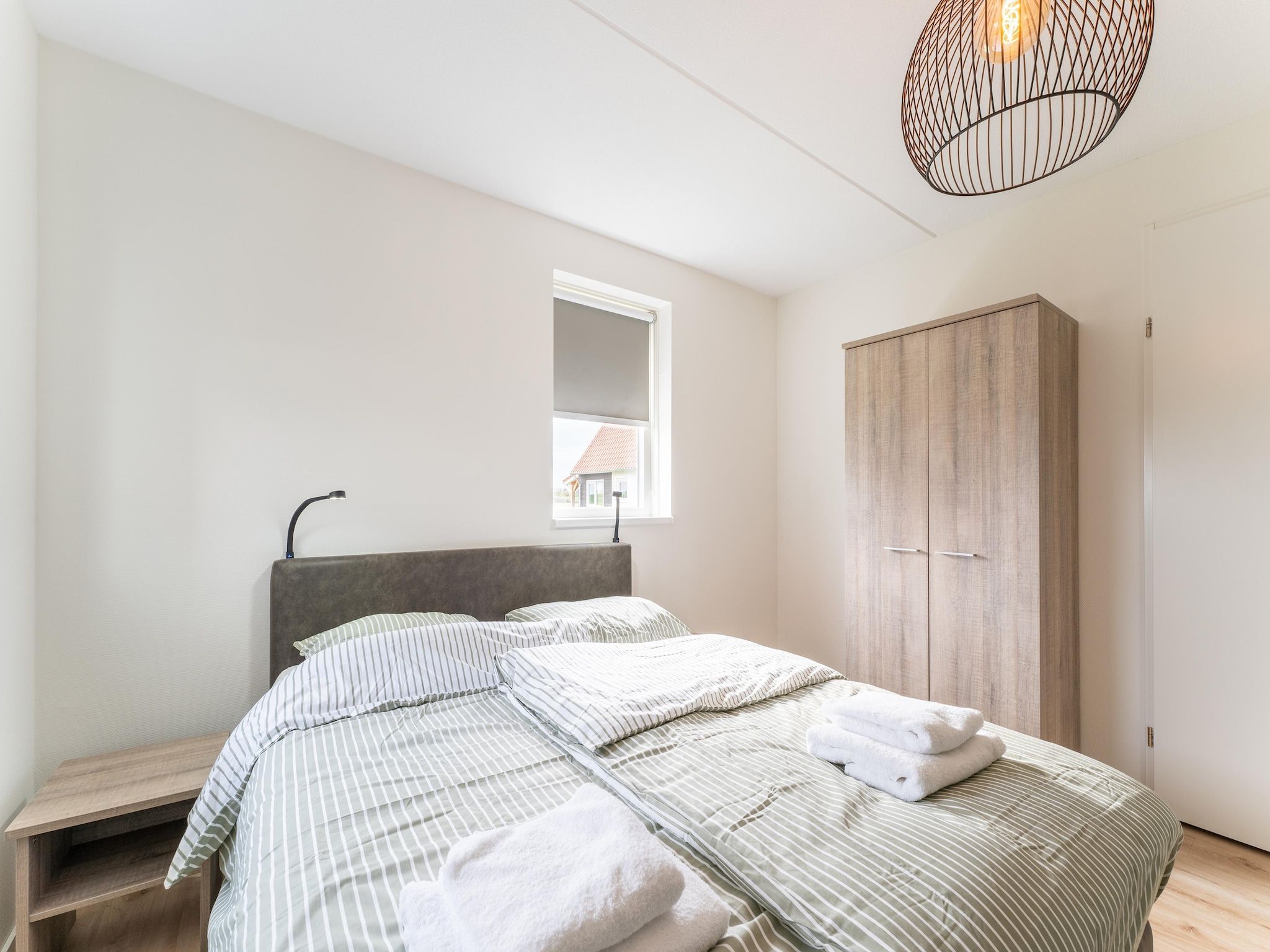 Een slaapkamer van De Reiger Huis Nr 46 in Scherpenisse