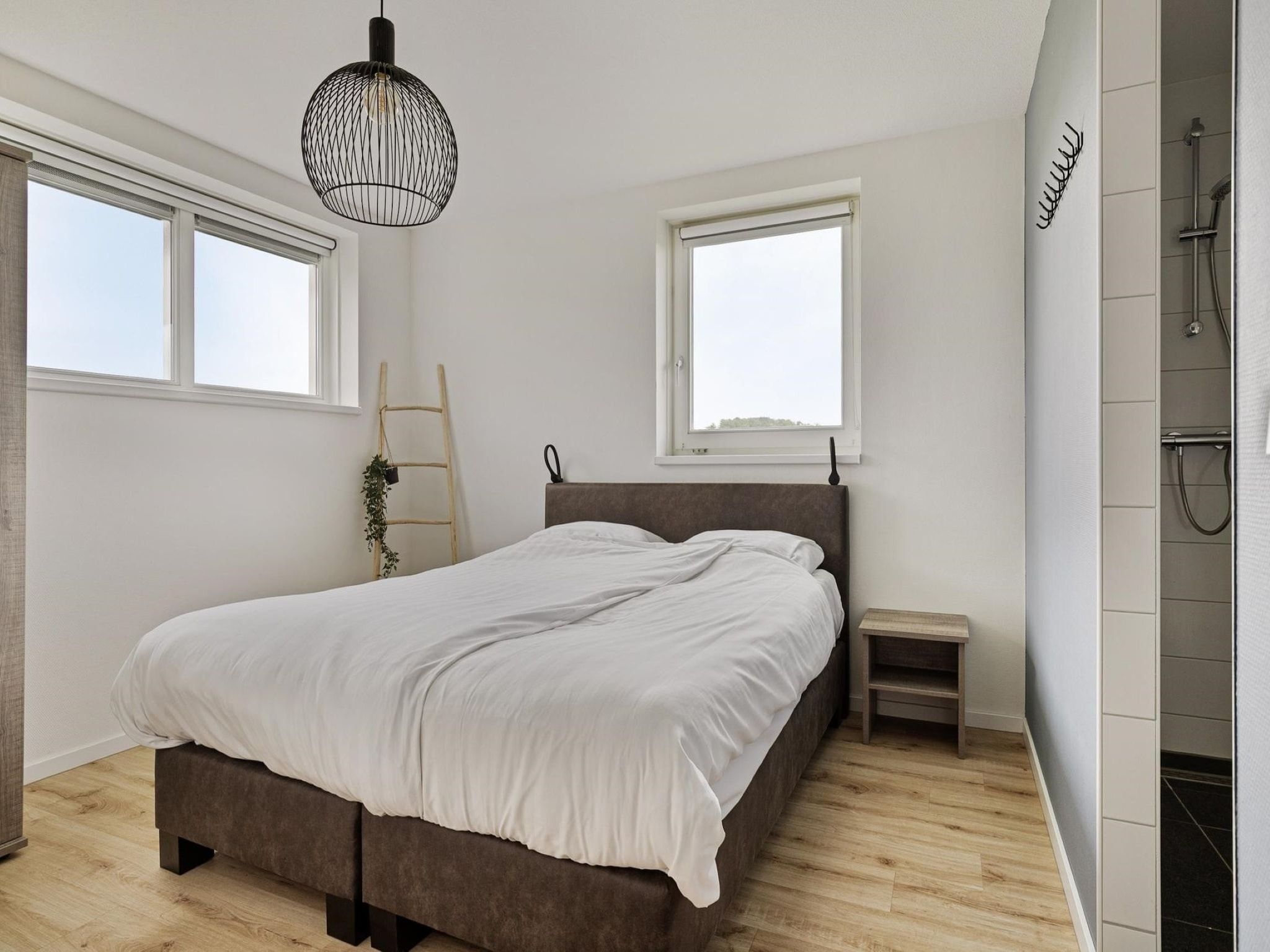 Een slaapkamer van De Ooievaar Huis Nr 47 in Scherpenisse