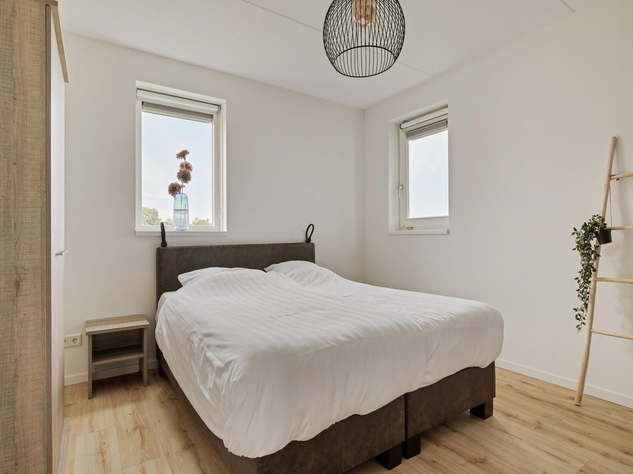 Een slaapkamer van De Ooievaar Huis Nr 47 in Scherpenisse