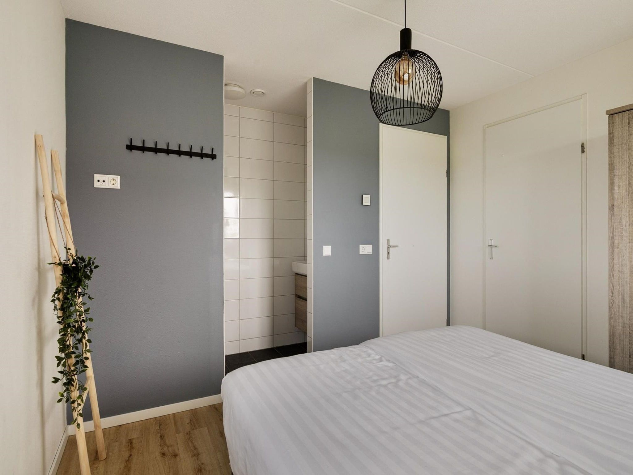 Een slaapkamer van De Ooievaar Huis Nr 47 in Scherpenisse