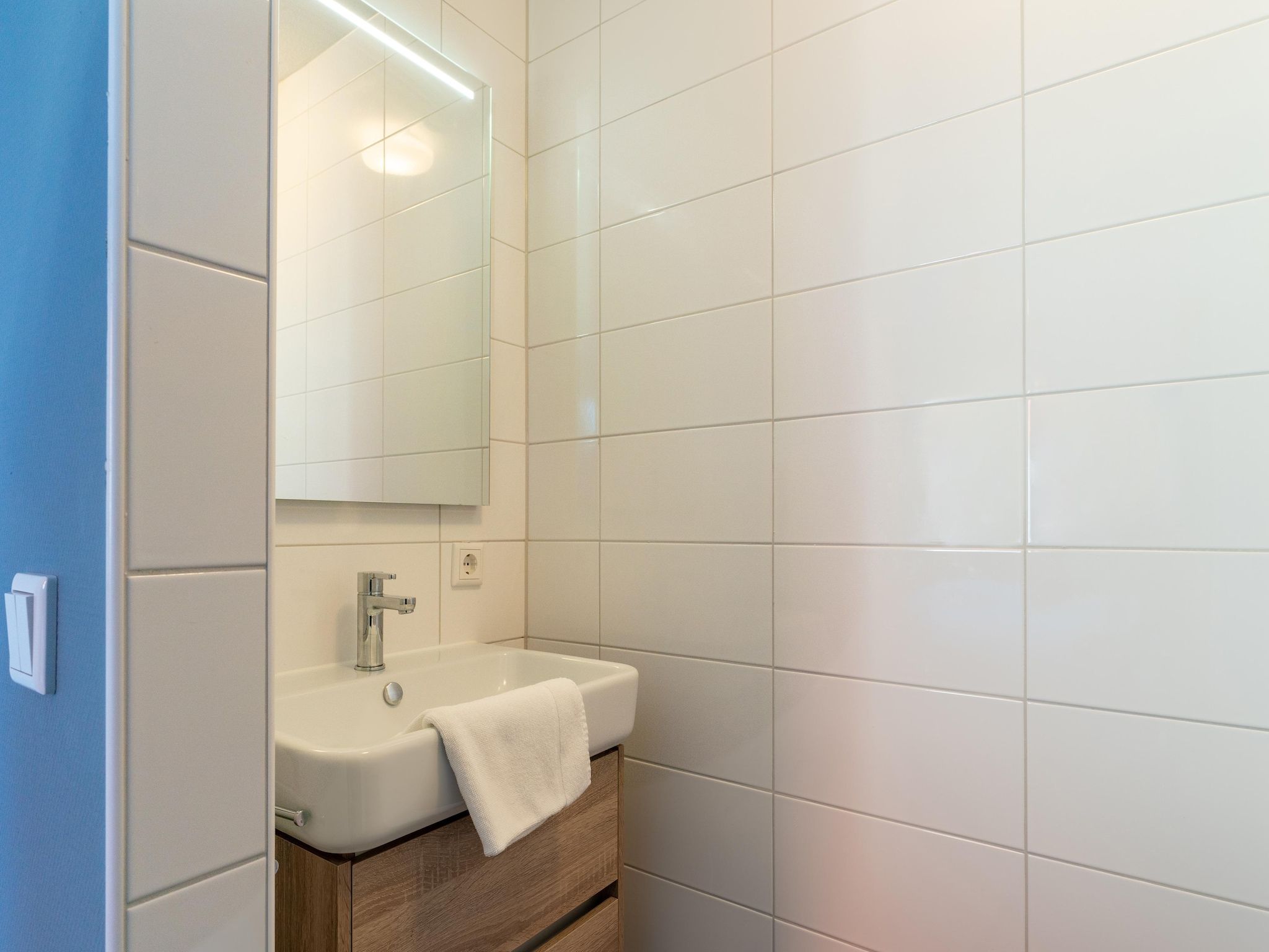 De badkamer van De Roodborst Huis Nr 31 in Scherpenisse