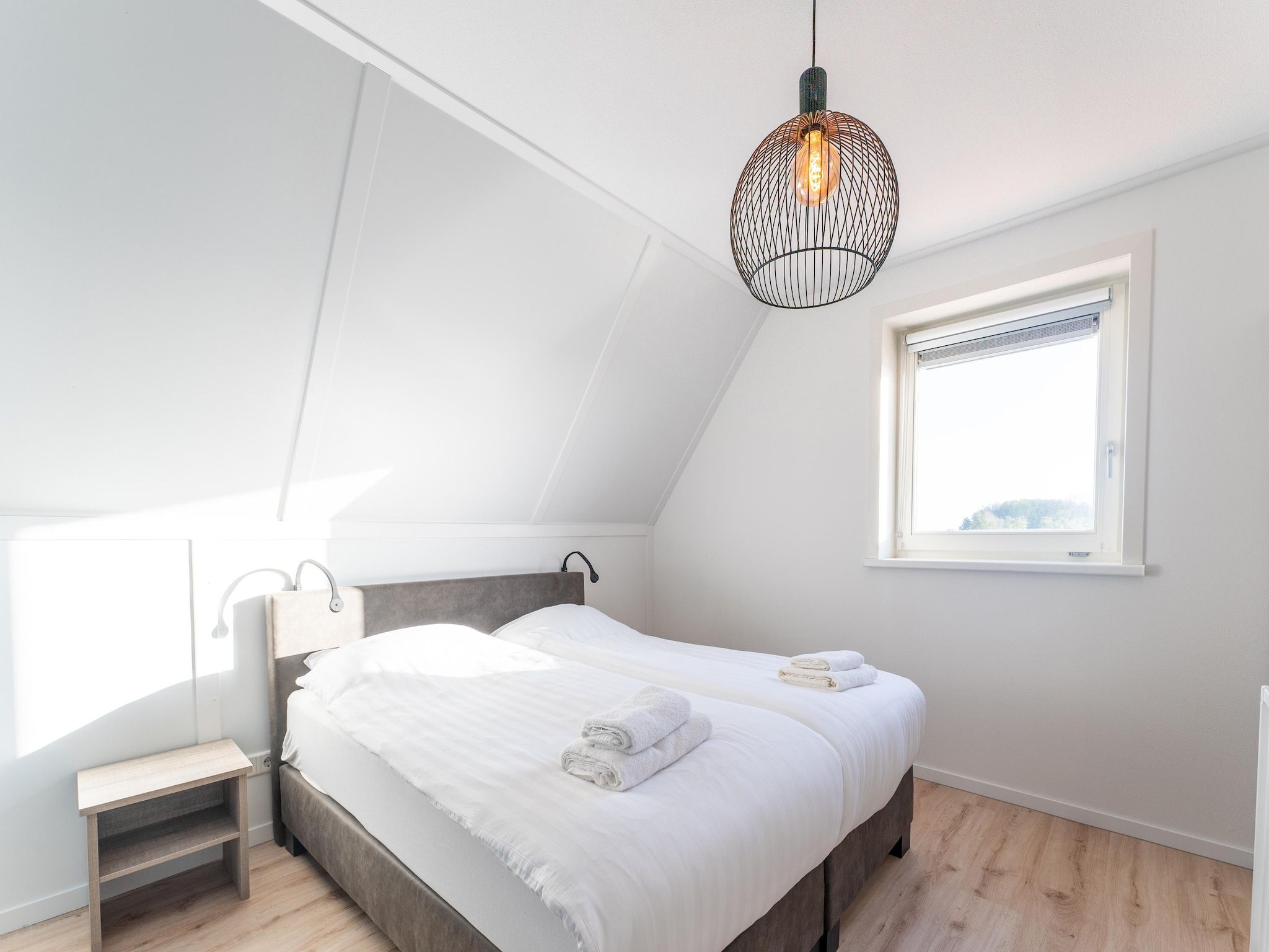 Een slaapkamer van De Roodborst Huis Nr 31 in Scherpenisse