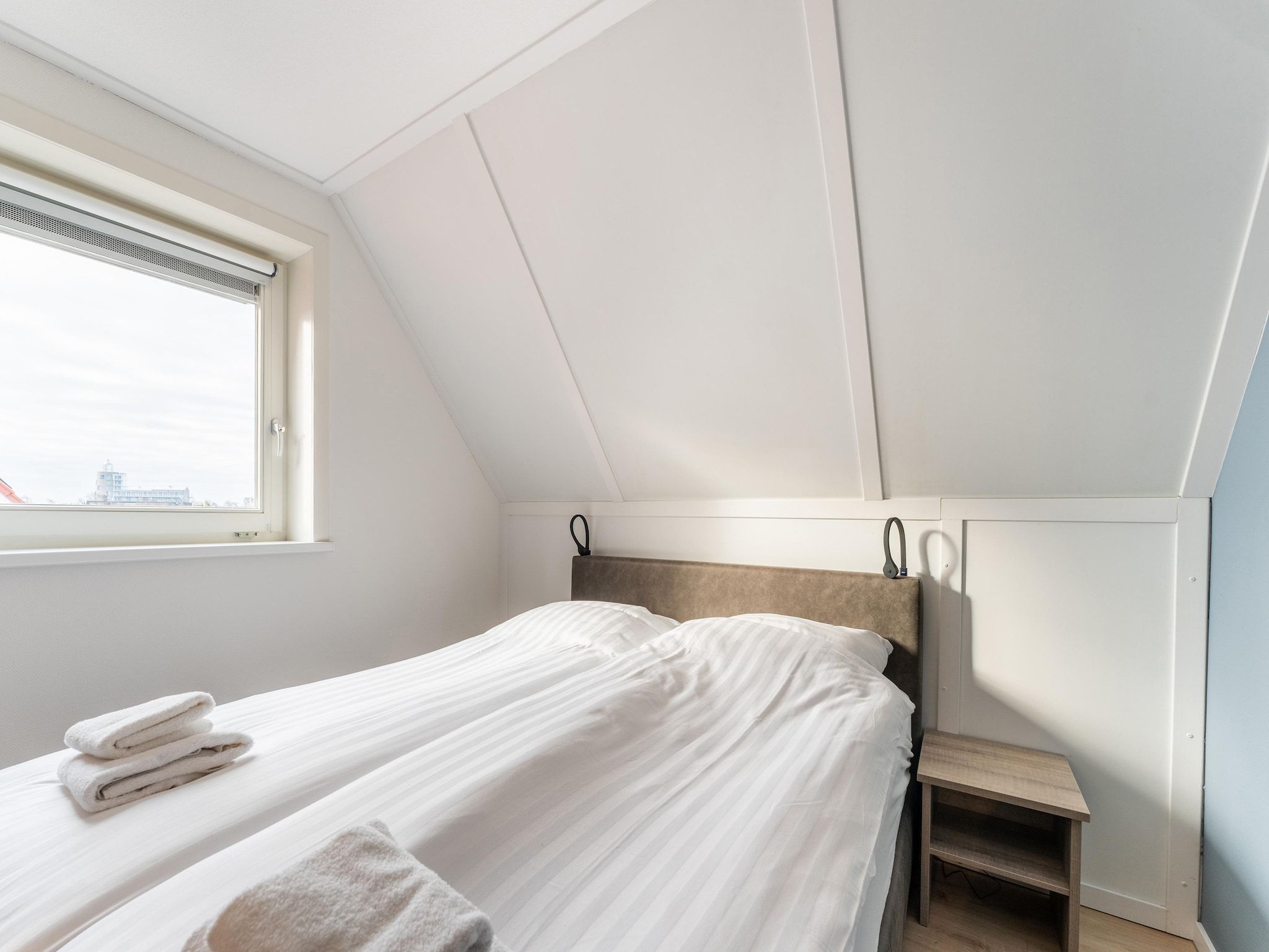 Een slaapkamer van De Pelikaan Huis Nr 45 in Scherpenisse