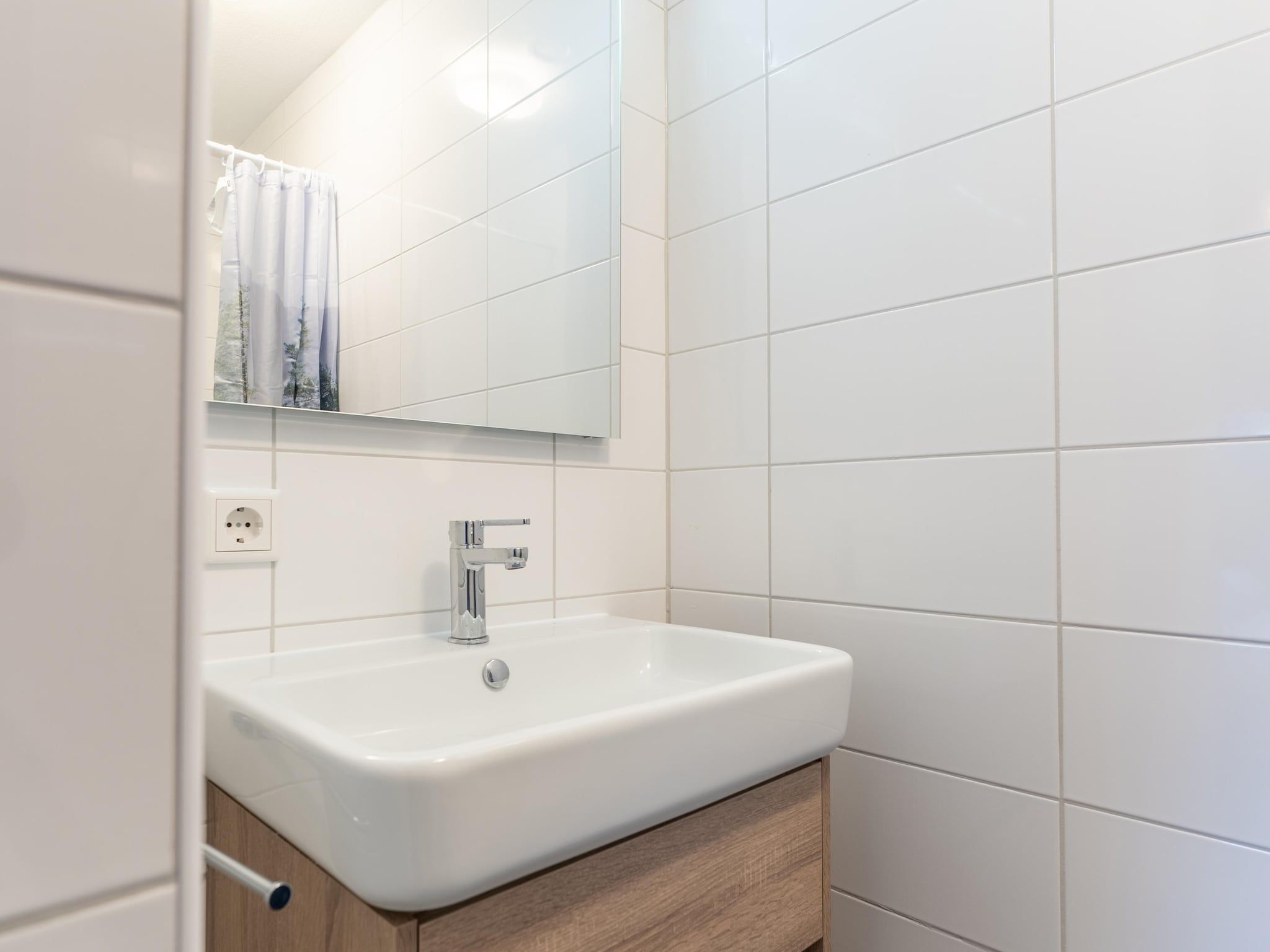 De badkamer van De Albatros Huis Nr 49 in Scherpenisse