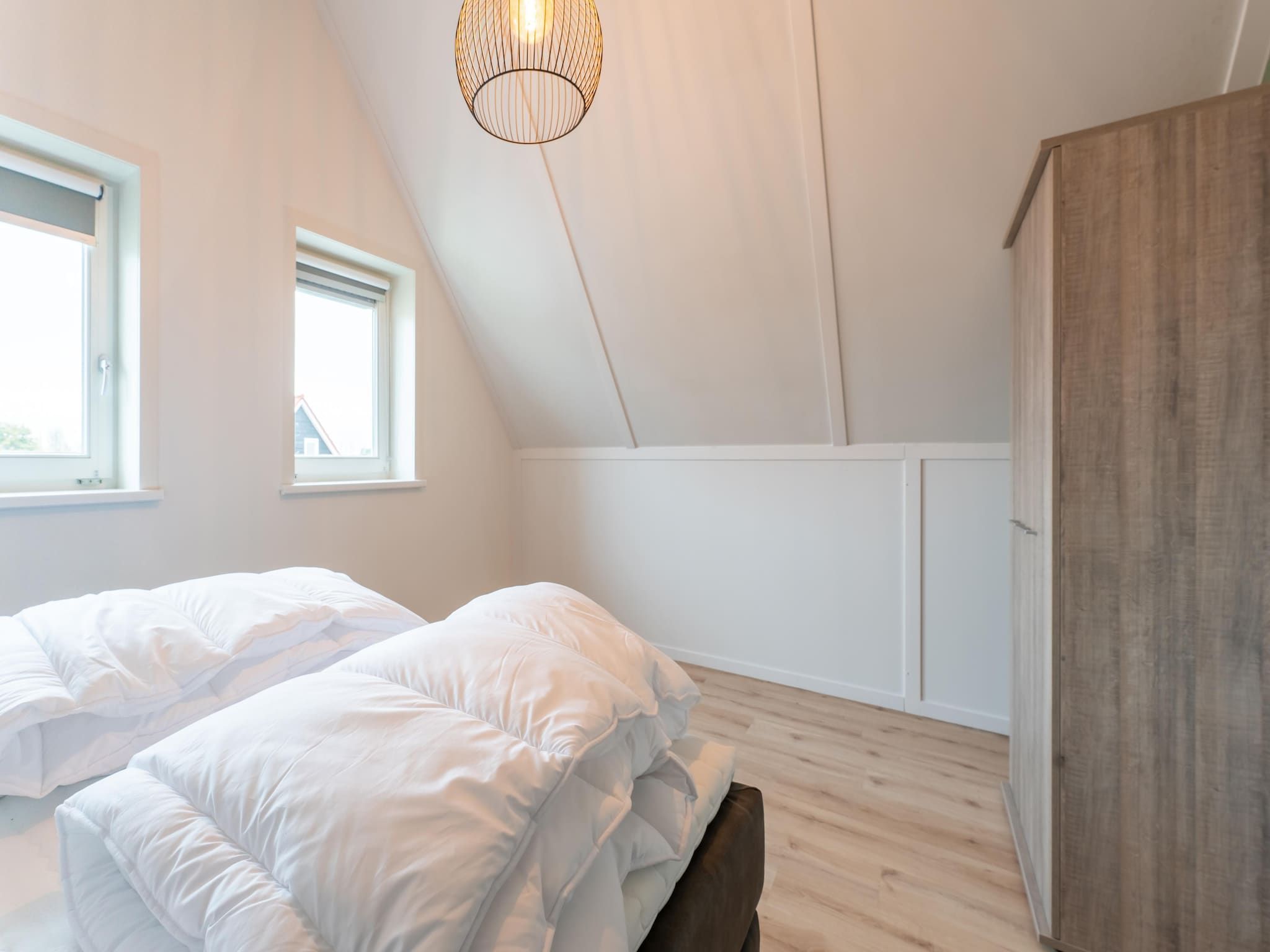 Een slaapkamer van De Albatros Huis Nr 49 in Scherpenisse