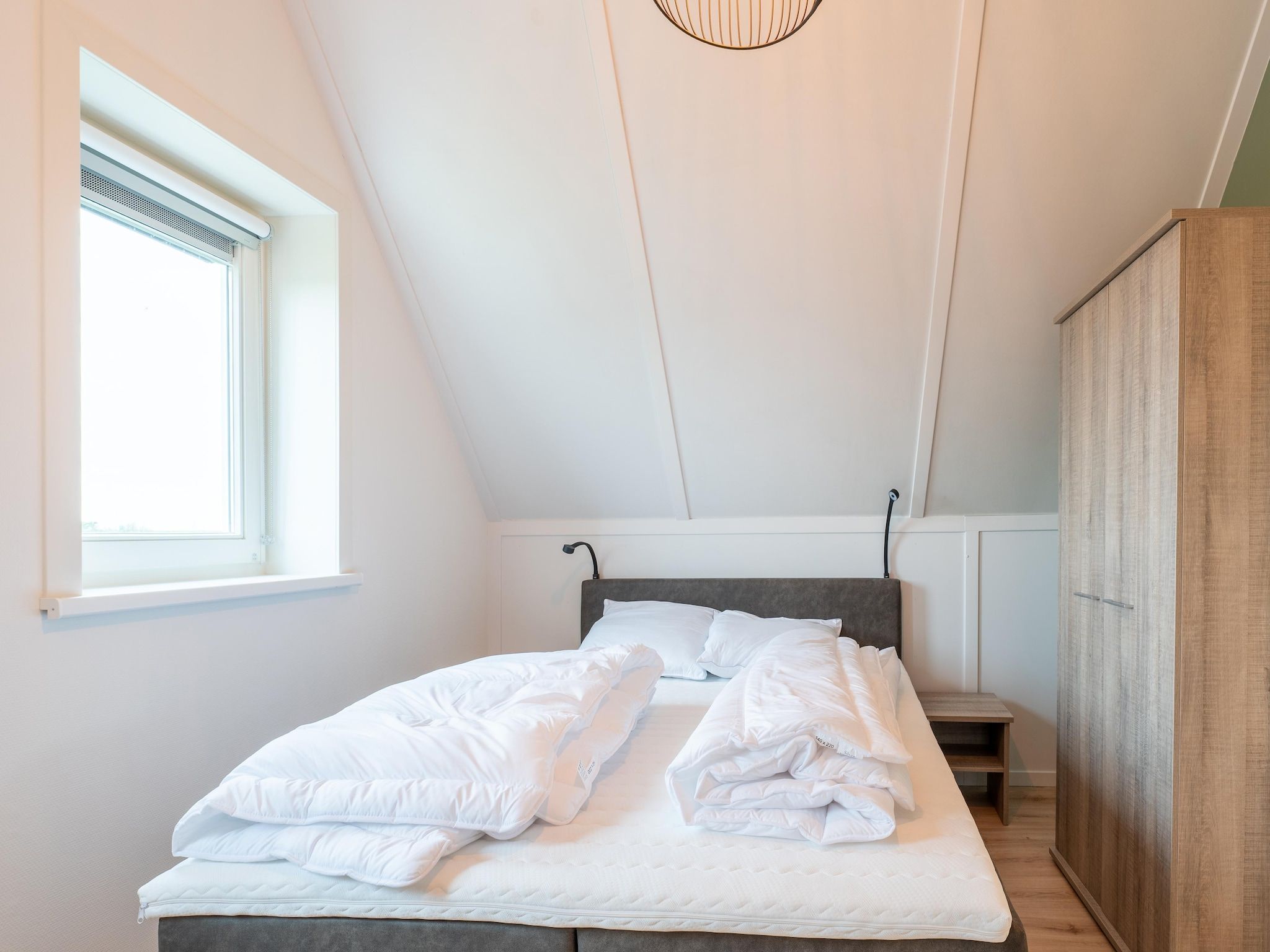 Een slaapkamer van De Albatros Huis Nr 49 in Scherpenisse