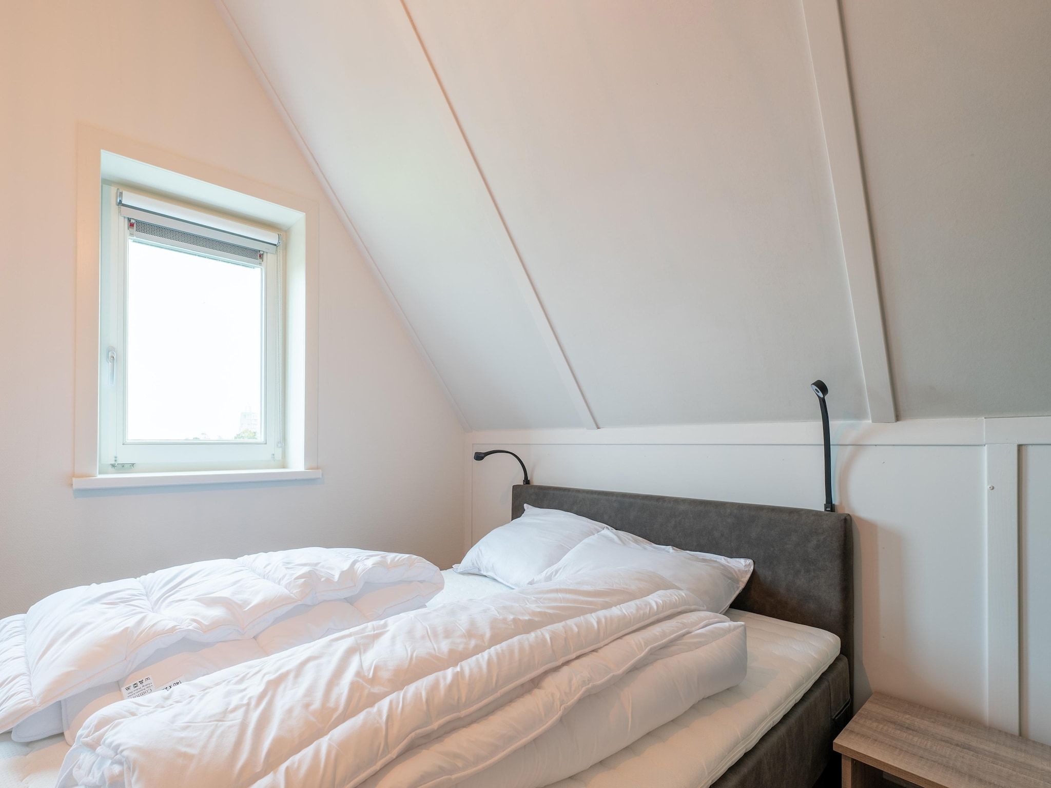 Een slaapkamer van De Albatros Huis Nr 49 in Scherpenisse