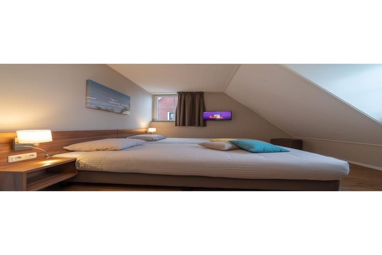 Een slaapkamer van Zeeuwse Pracht Kindervilla in Colijnsplaat