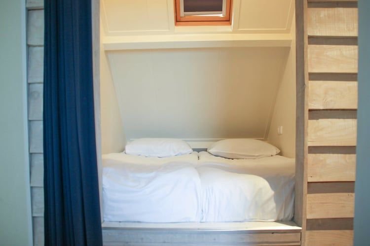 Een slaapkamer van Recreatiepark de Boshoek 17 in Voorthuizen
