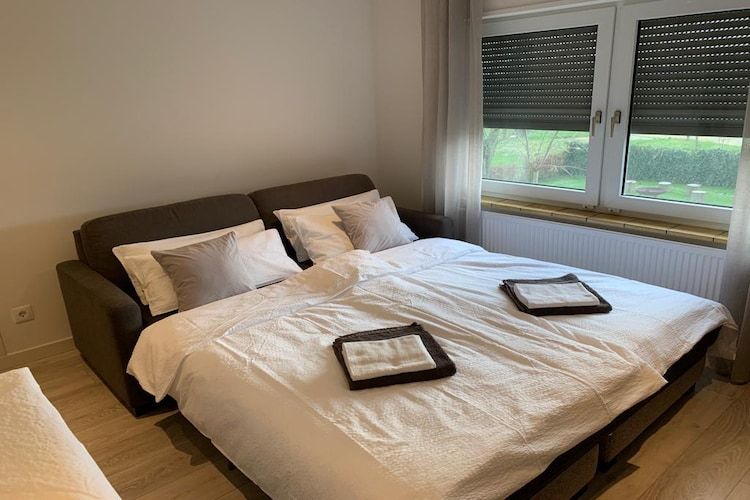 Een slaapkamer van Villa Grenszicht in Megchelen