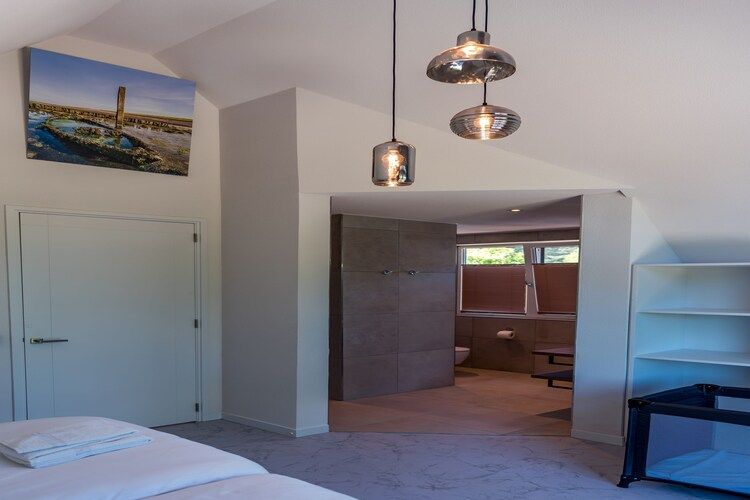 Een slaapkamer van Blauwe Kiekendief in Den Burg